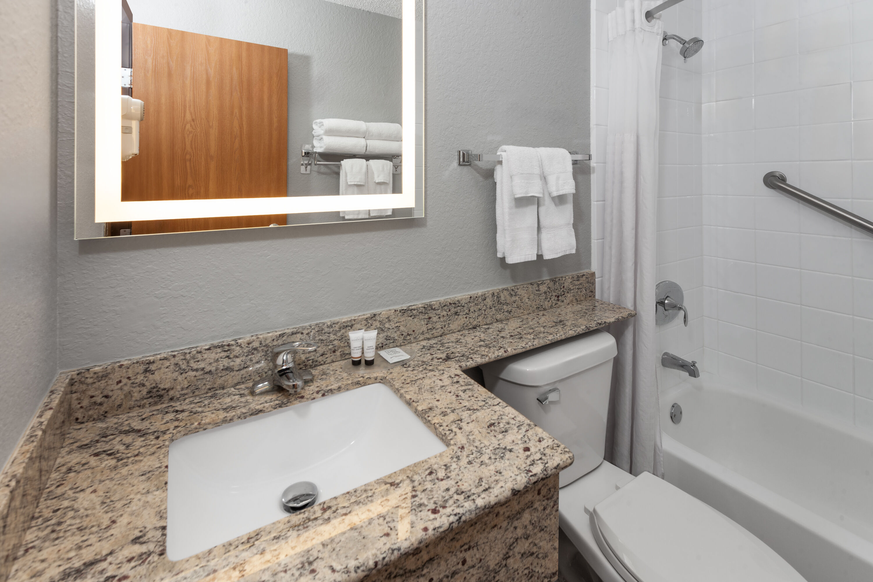 Guest room at the AmericInn by Wyndham Plymouth in Plymouth, Wisconsin