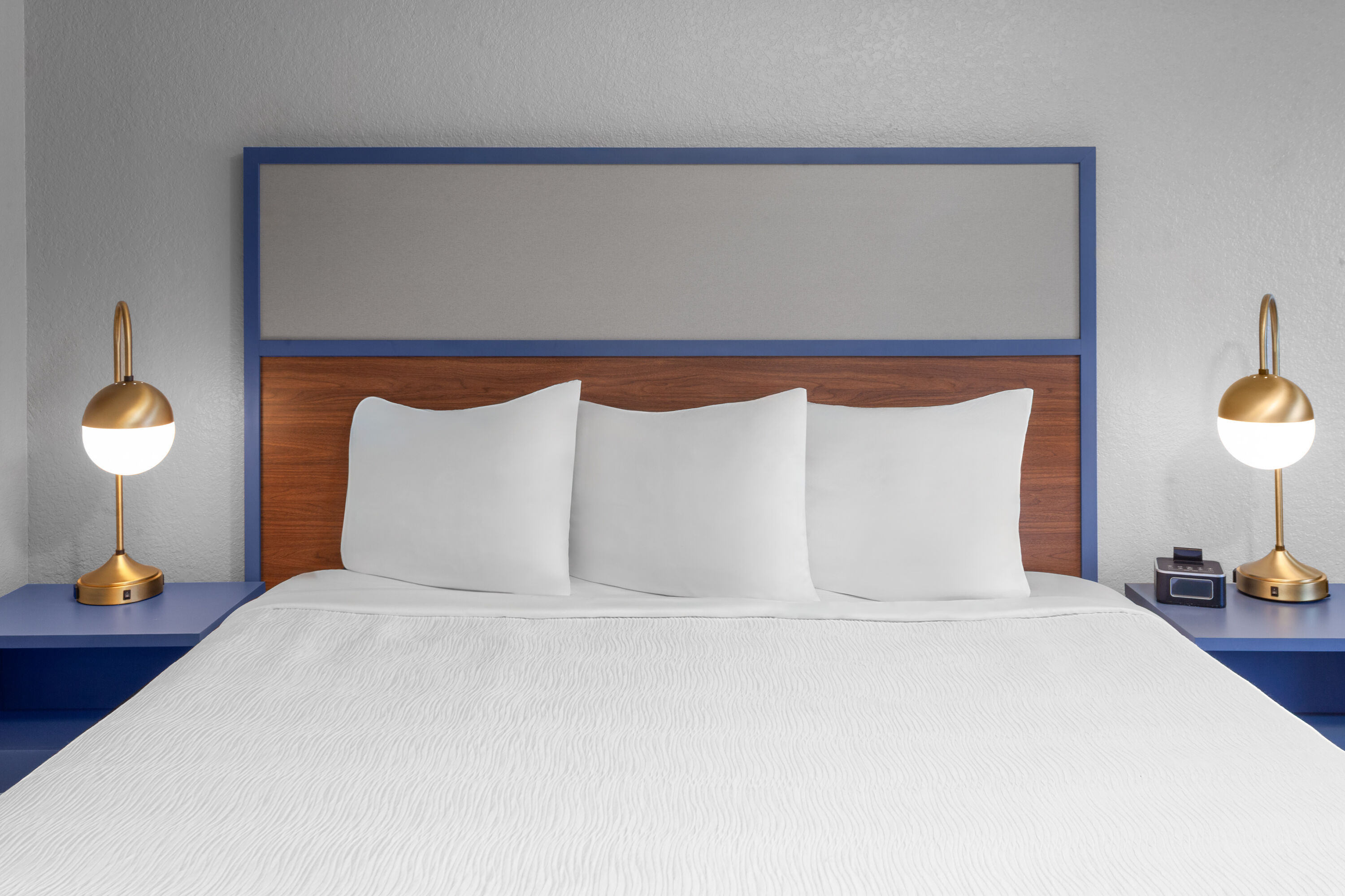 Guest room at the AmericInn by Wyndham Plymouth in Plymouth, Wisconsin