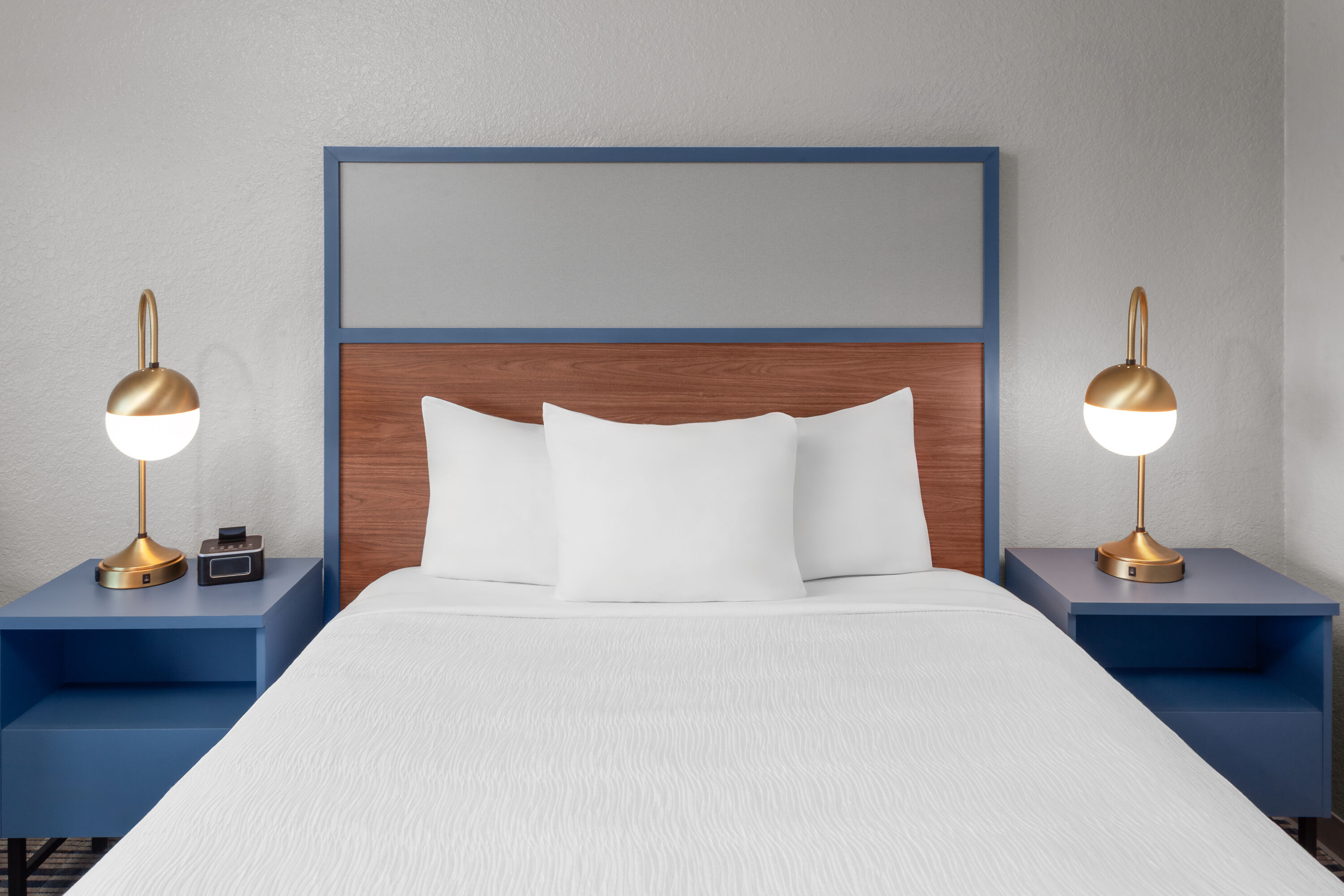 Guest room at the AmericInn by Wyndham Plymouth in Plymouth, Wisconsin