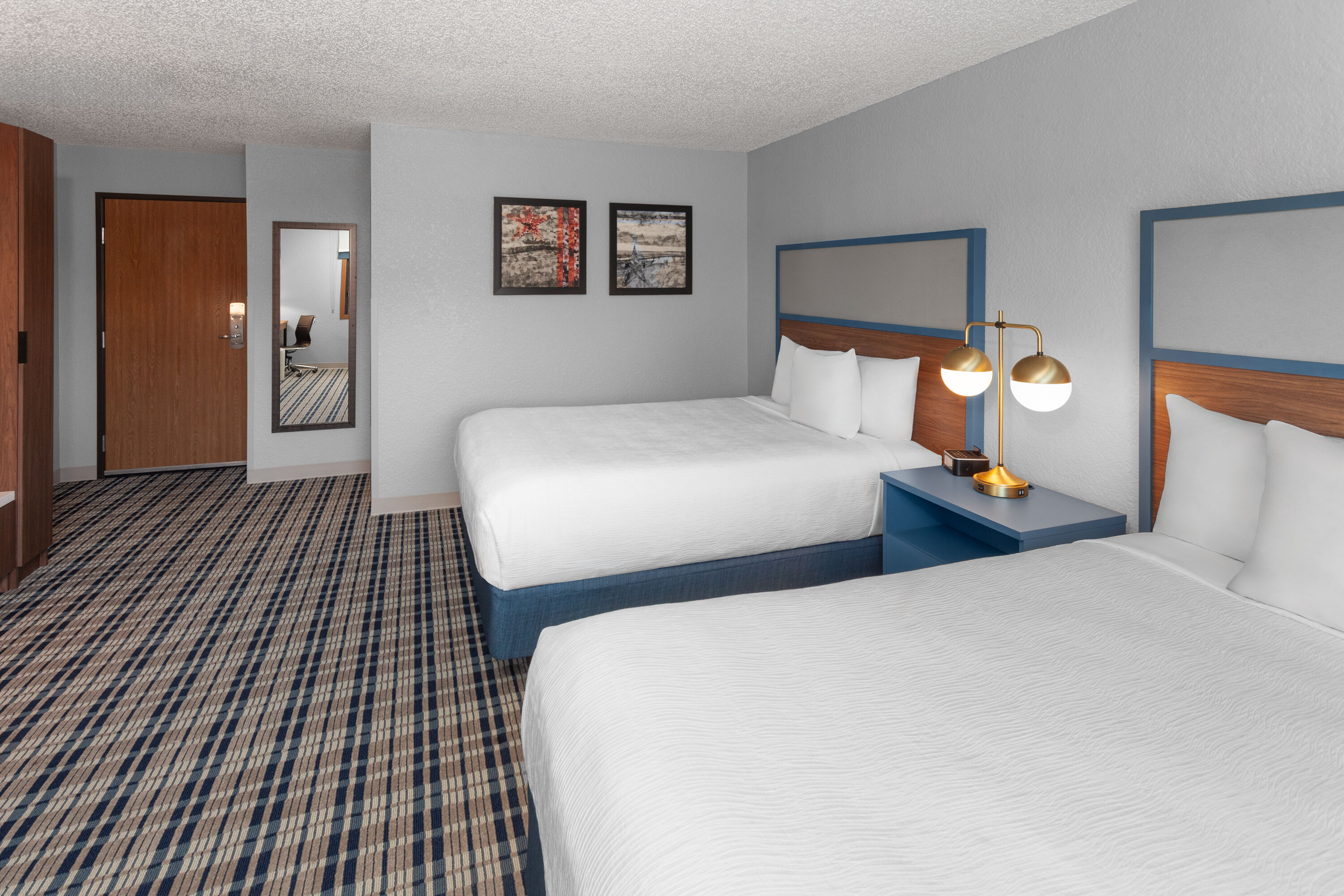 Guest room at the AmericInn by Wyndham Plymouth in Plymouth, Wisconsin