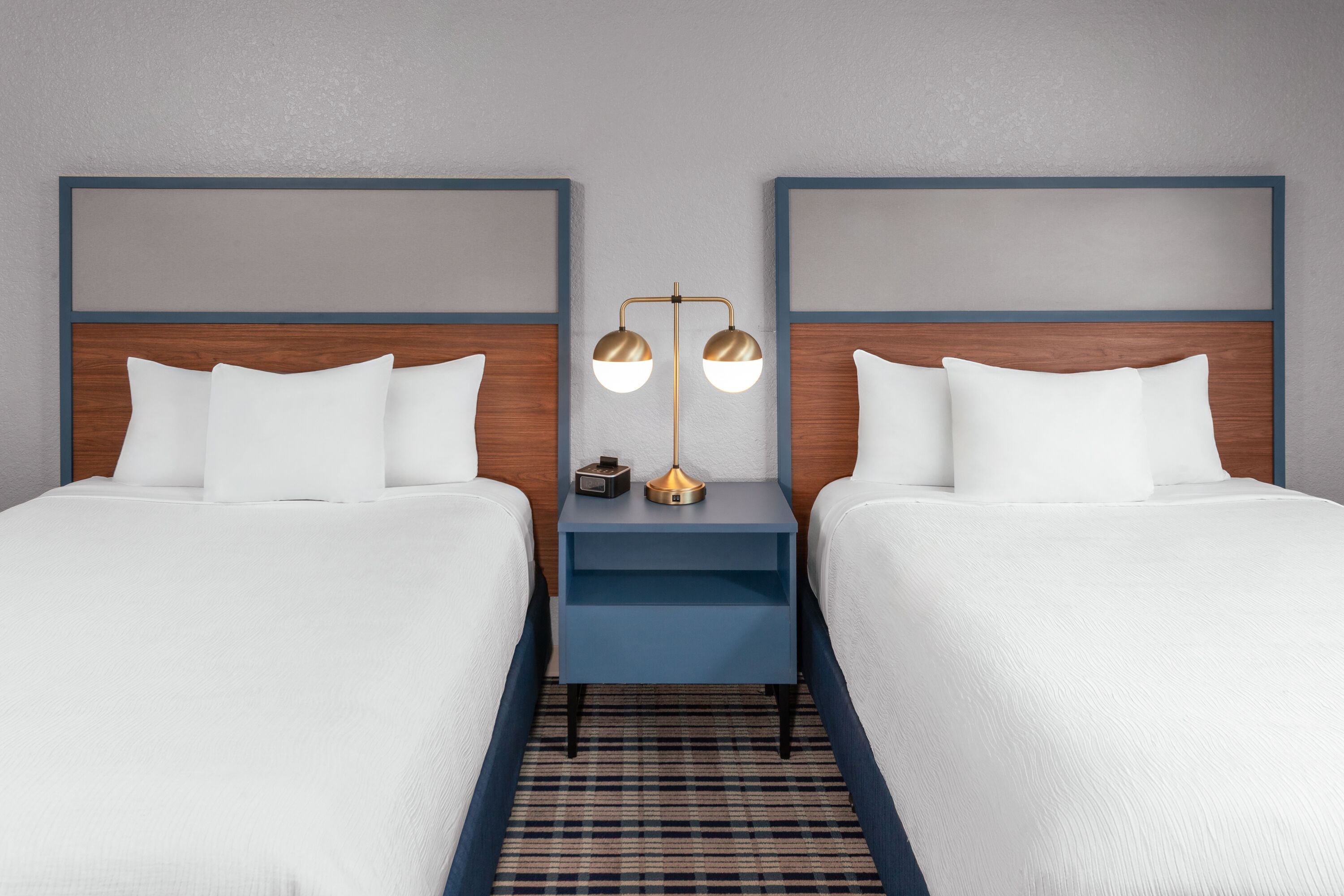 Guest room at the AmericInn by Wyndham Plymouth in Plymouth, Wisconsin