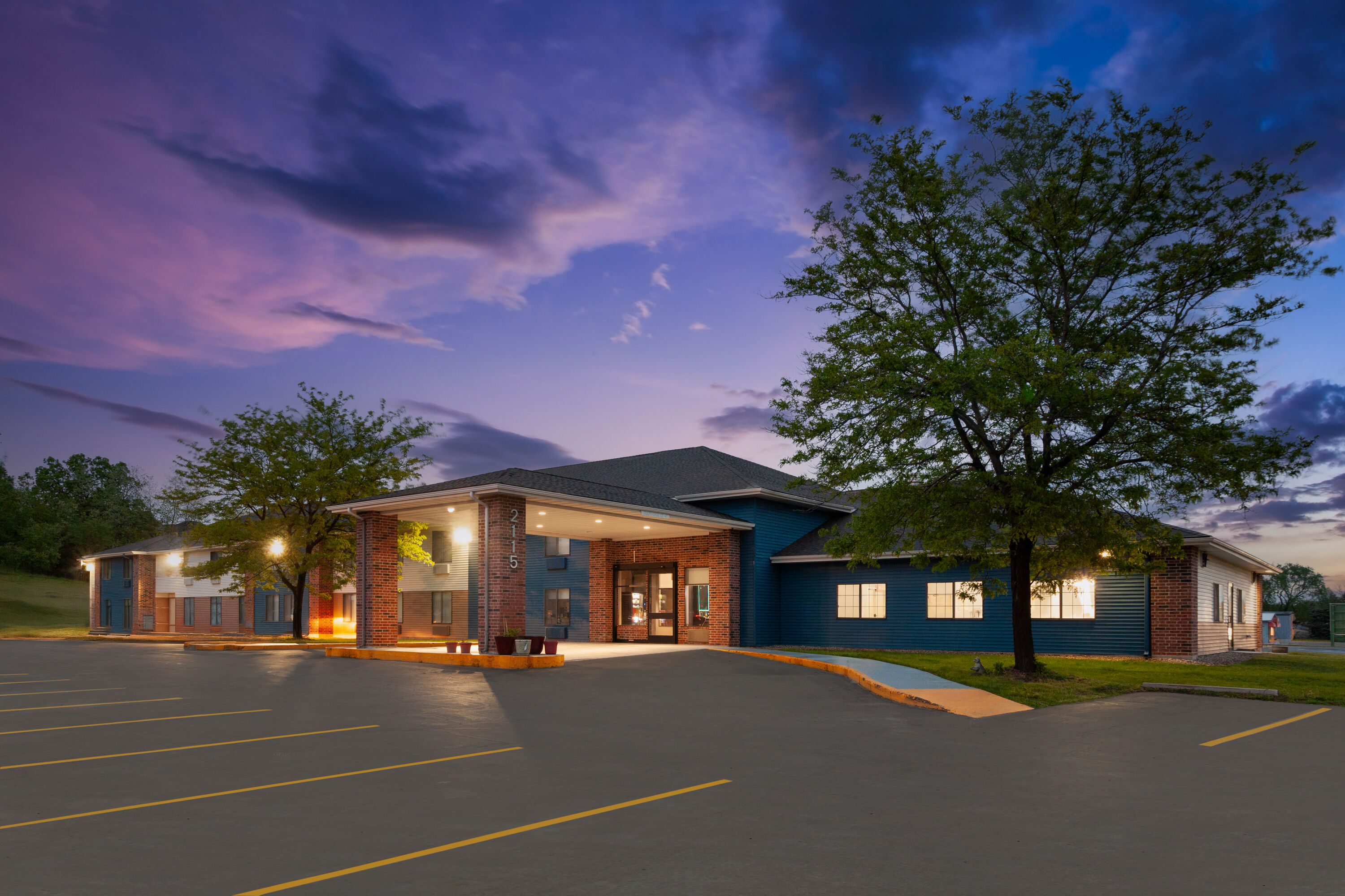 Exterior Dusk Image of AmericInn by Wyndham Reedsburg hotel in Reedsburg, Wisconsin