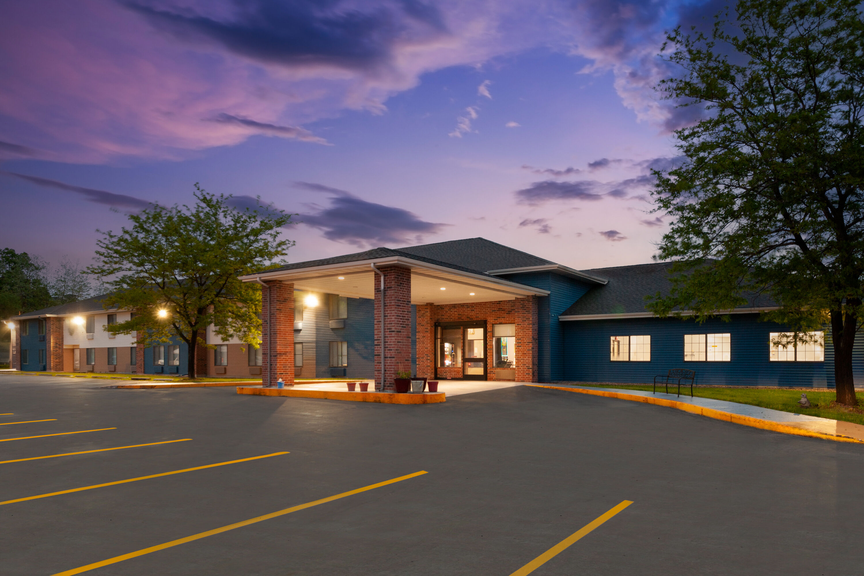 Exterior Dusk Image of AmericInn by Wyndham Reedsburg hotel in Reedsburg, Wisconsin