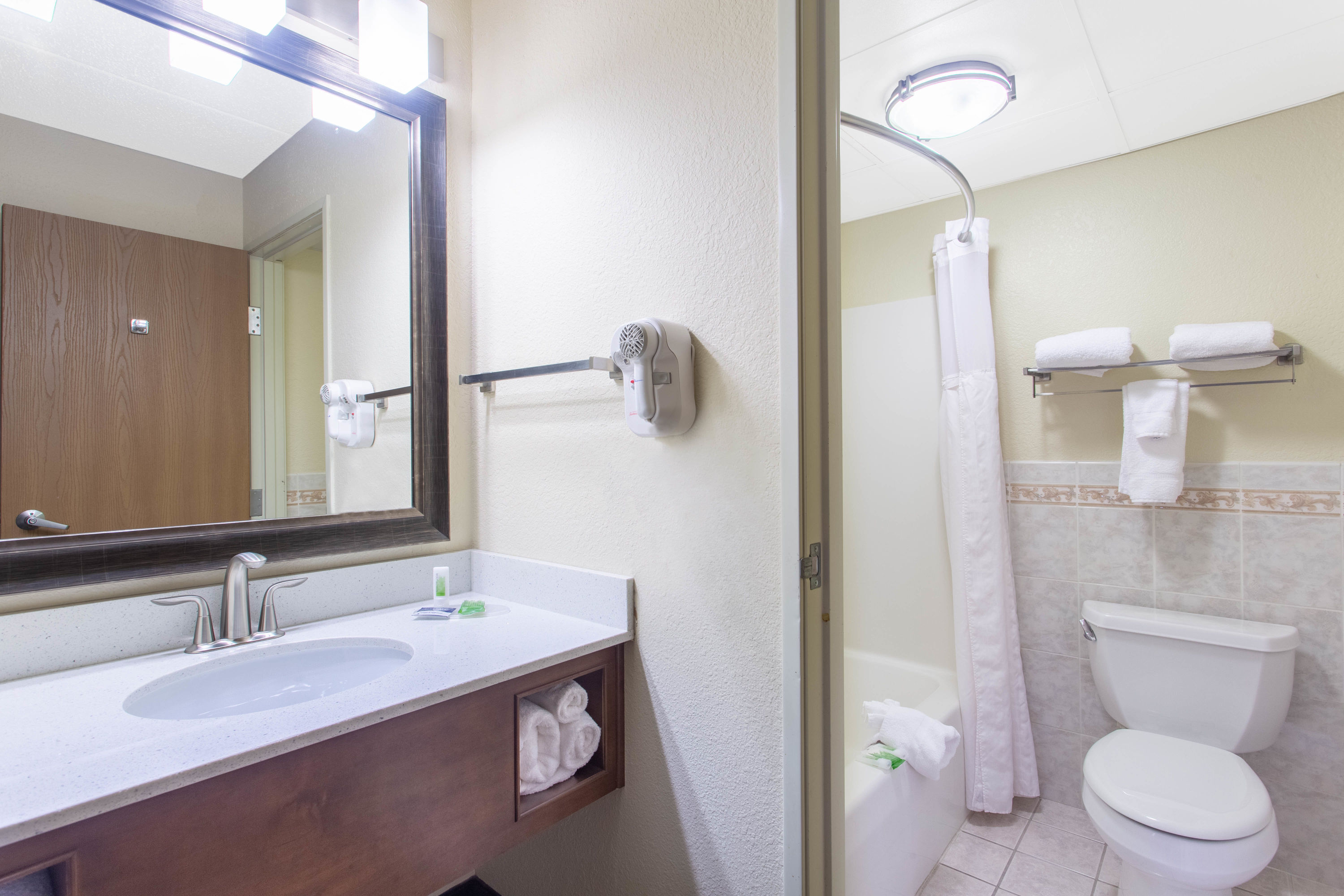 Guest room bath at the AmericInn by Wyndham Sheboygan in Sheboygan, Wisconsin