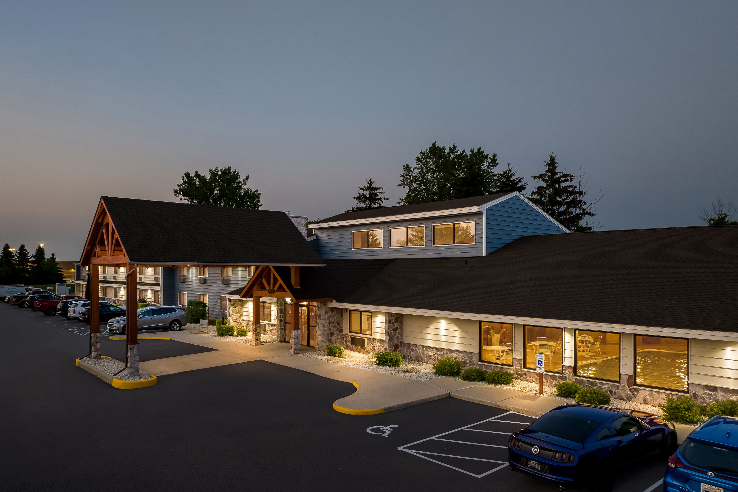 Exterior Night Image of AmericInn by Wyndham Sturgeon Bay hotel in Sturgeon Bay, Wisconsin