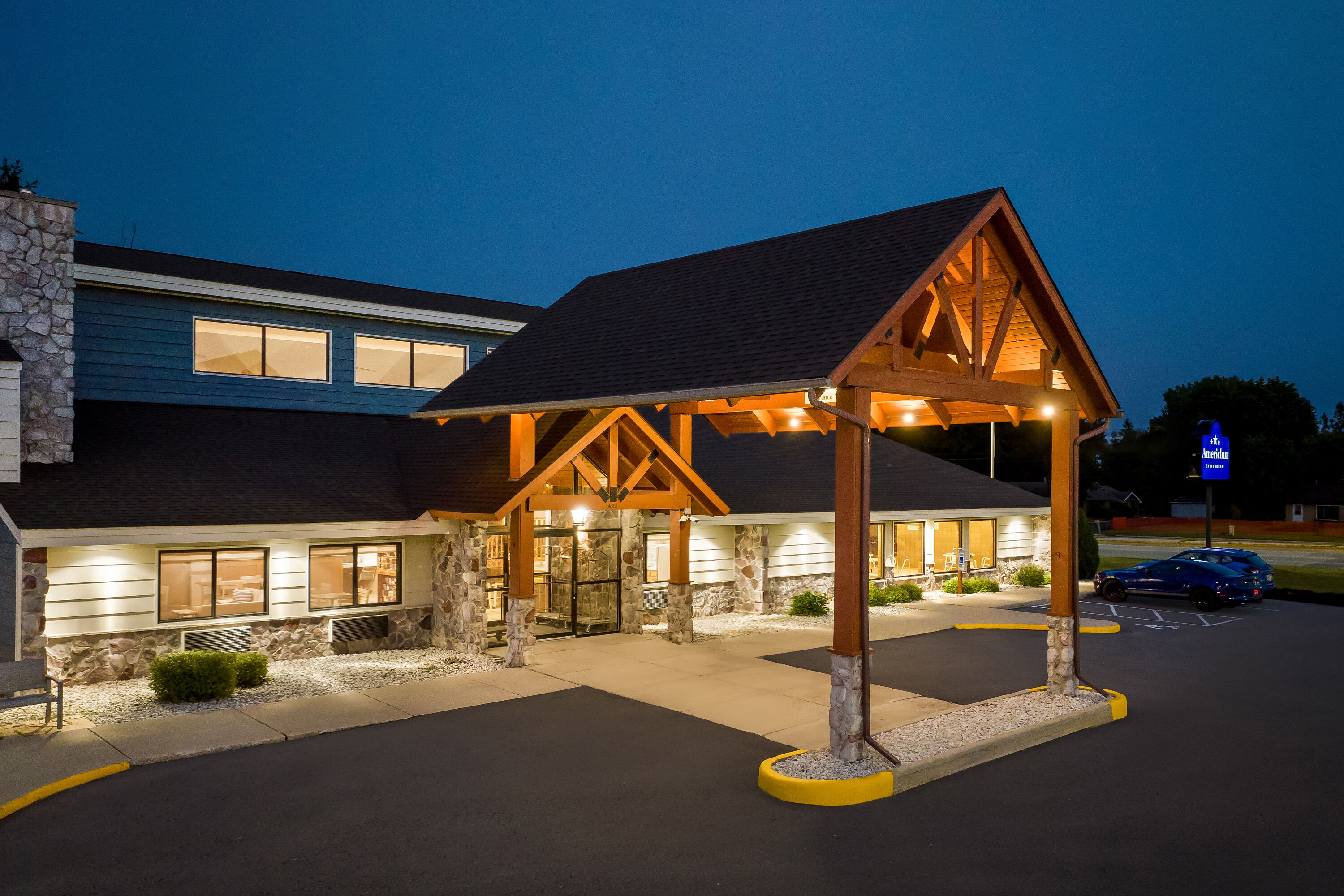 Exterior Night Image of AmericInn by Wyndham Sturgeon Bay hotel in Sturgeon Bay, Wisconsin