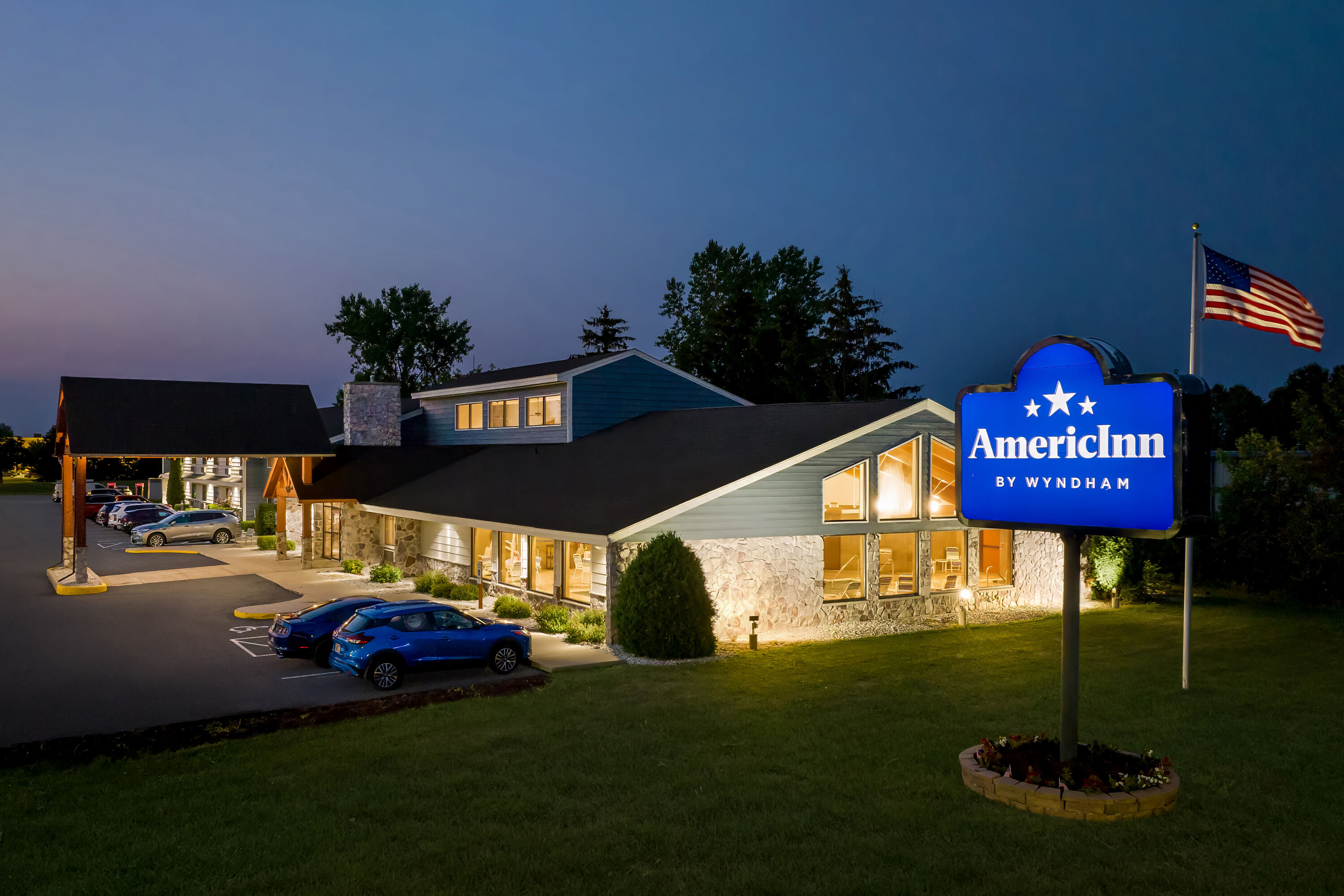 Exterior Night Image of AmericInn by Wyndham Sturgeon Bay hotel in Sturgeon Bay, Wisconsin