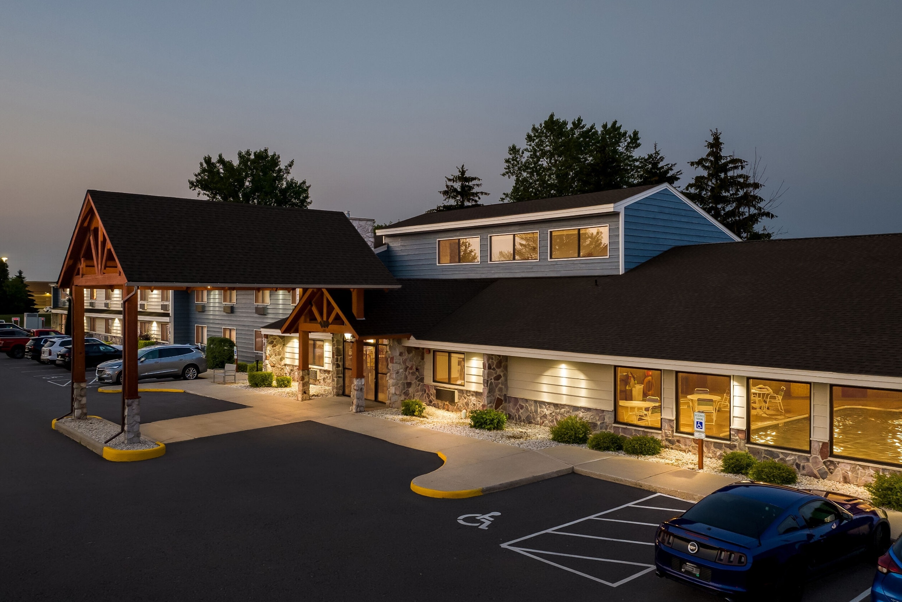 Exterior Night Image of AmericInn by Wyndham Sturgeon Bay hotel in Sturgeon Bay, Wisconsin