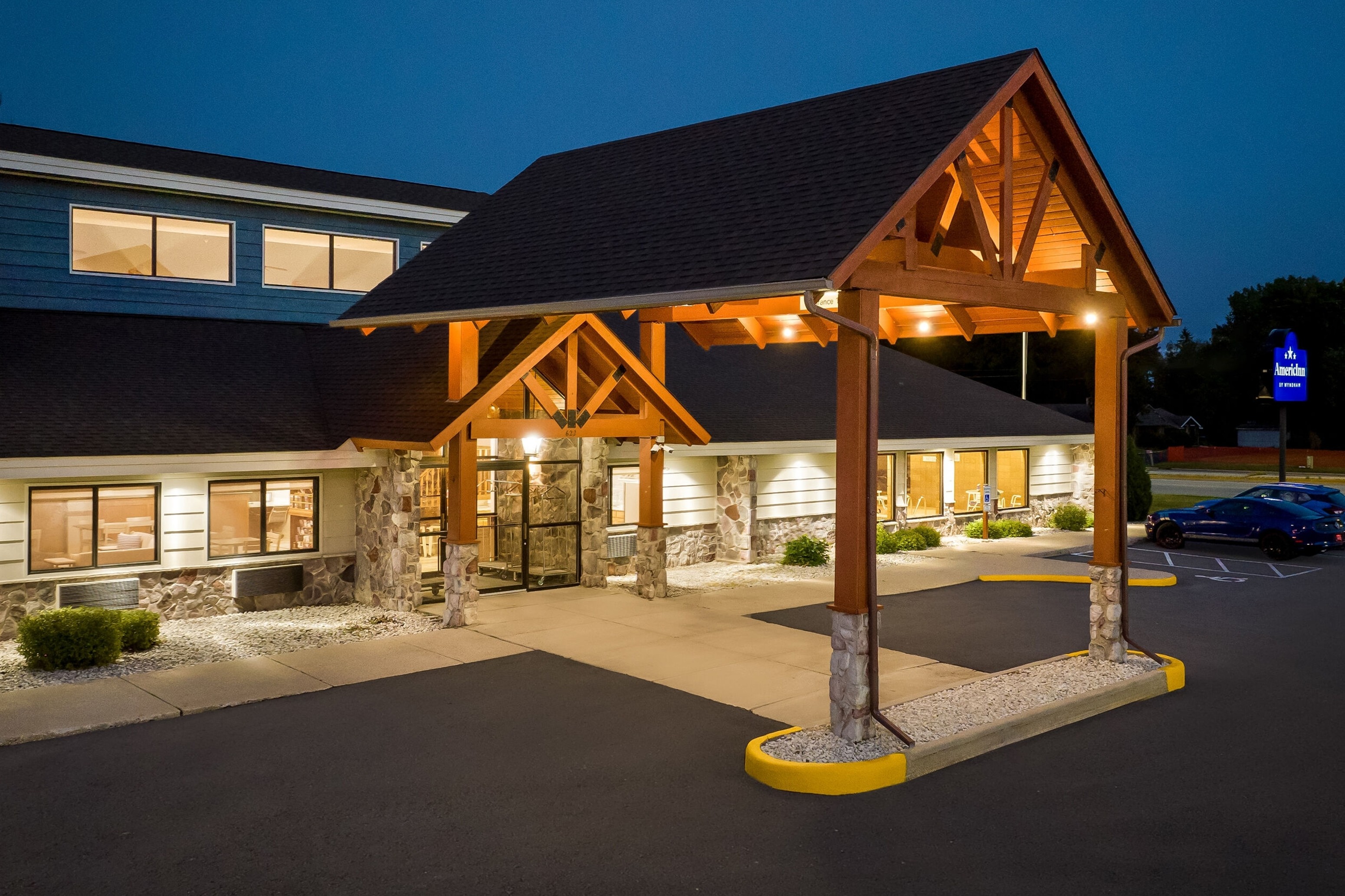 Exterior Night Image of AmericInn by Wyndham Sturgeon Bay hotel in Sturgeon Bay, Wisconsin