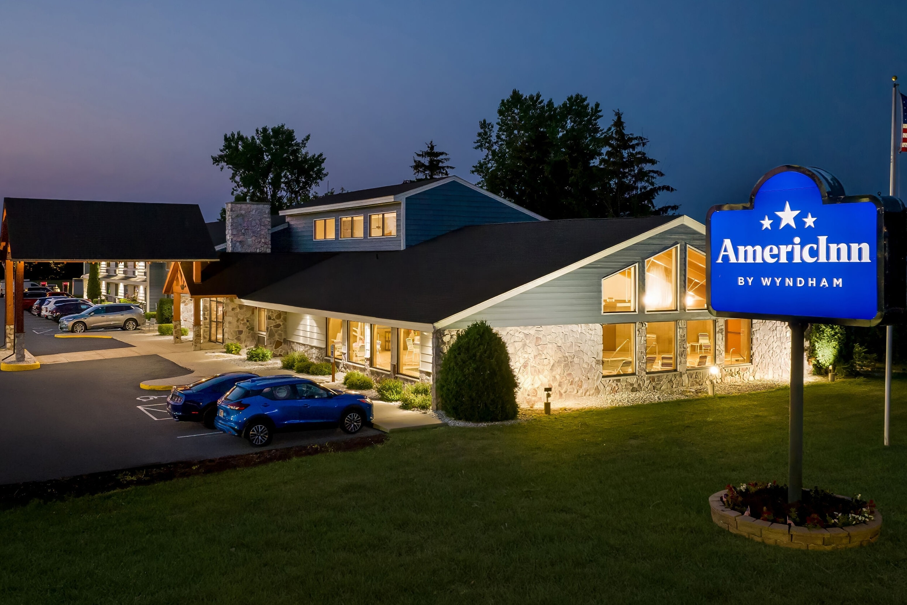 Exterior Night Image of AmericInn by Wyndham Sturgeon Bay hotel in Sturgeon Bay, Wisconsin