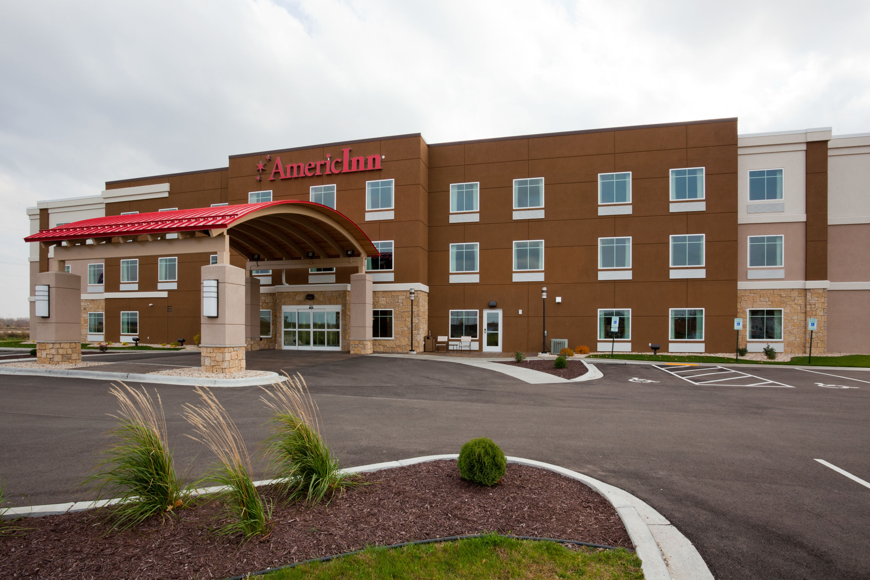 Exterior Day Image of AmericInn by Wyndham Waupun hotel in Waupun, Wisconsin