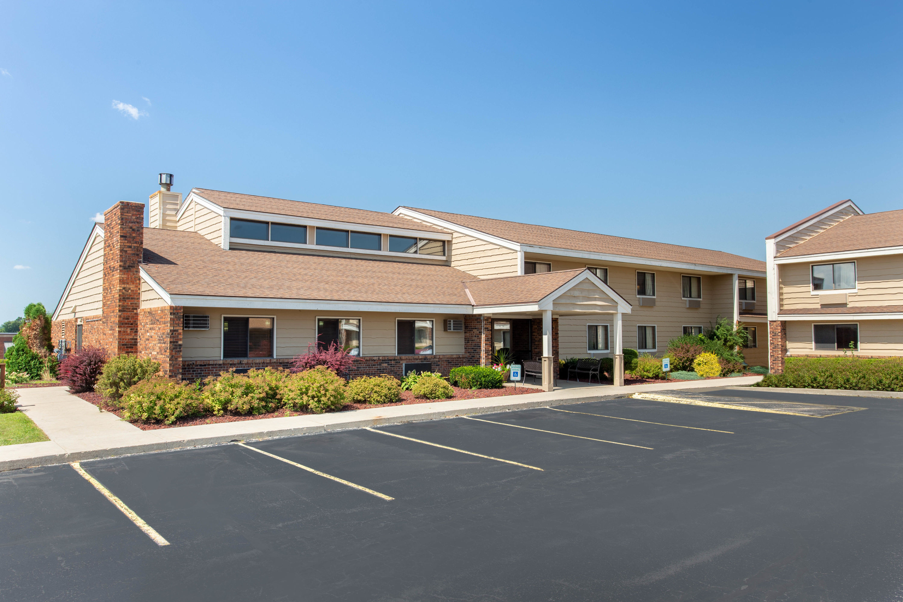 Exterior Day Image of AmericInn by Wyndham West Bend hotel in West Bend, Wisconsin