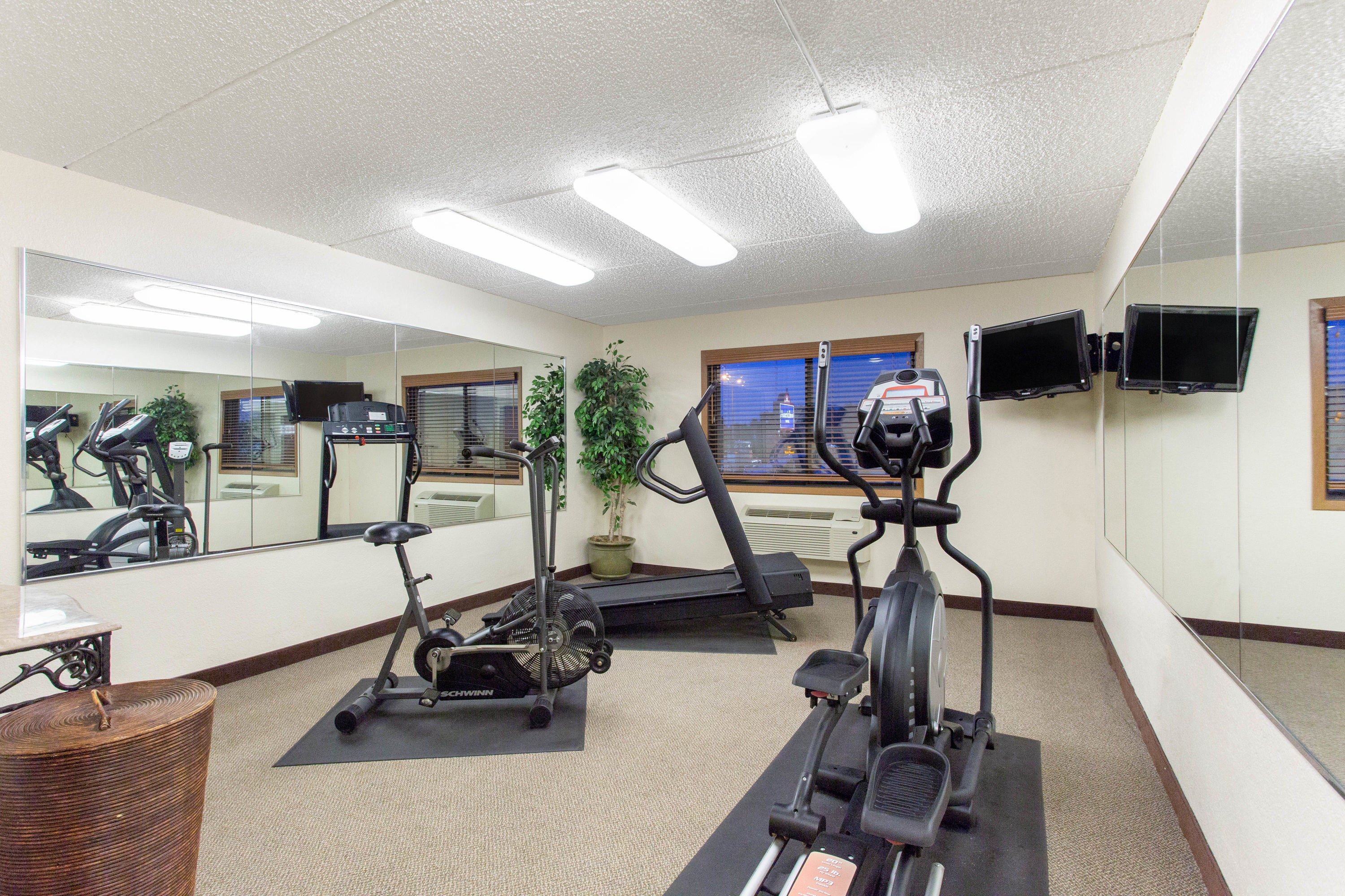 Fitness room at AmericInn by Wyndham West Bend in West Bend, Wisconsin
