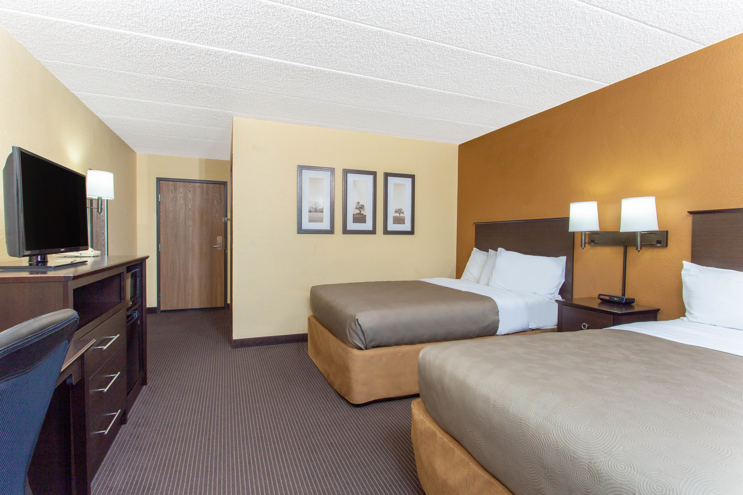 Guest room at the AmericInn by Wyndham West Bend in West Bend, Wisconsin