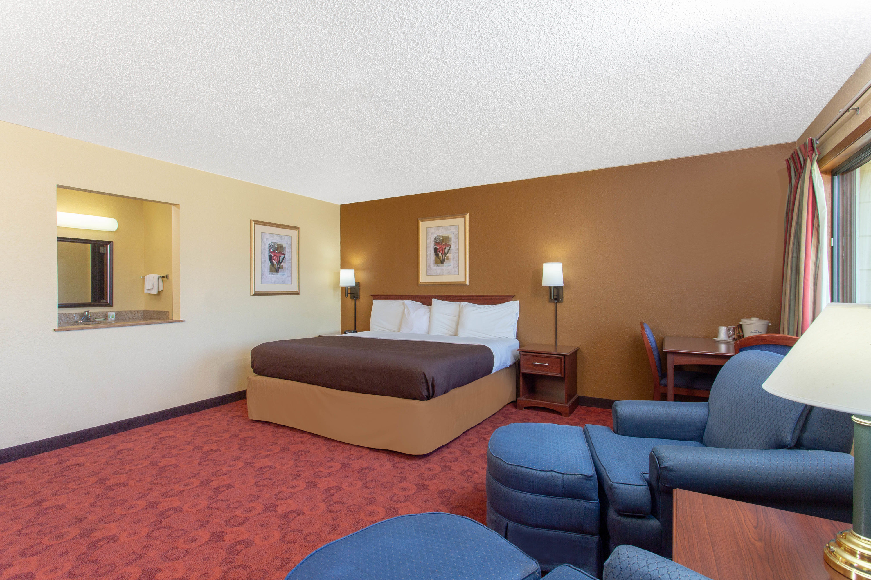 Guest room at the AmericInn by Wyndham West Bend in West Bend, Wisconsin