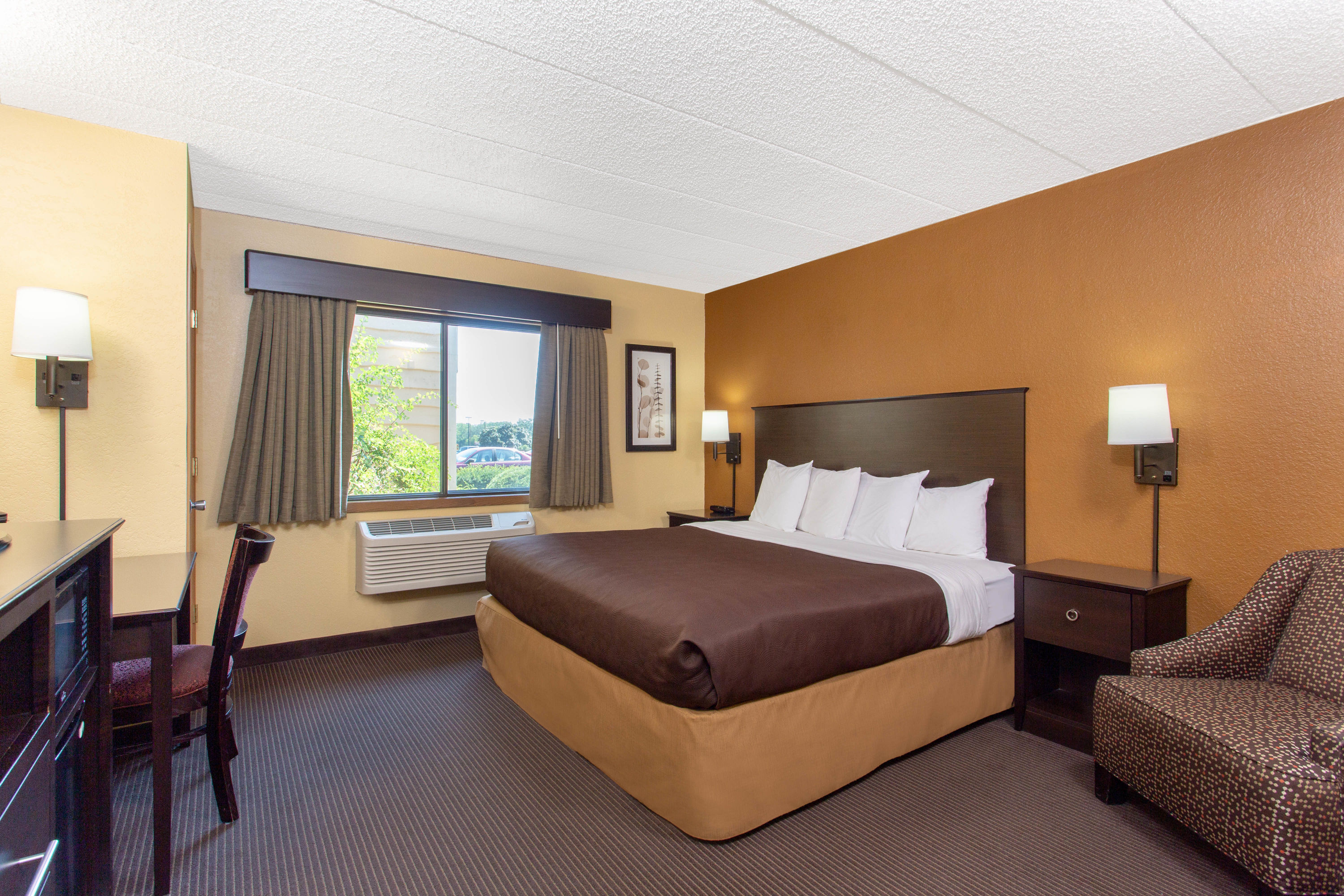 Guest room at the AmericInn by Wyndham West Bend in West Bend, Wisconsin