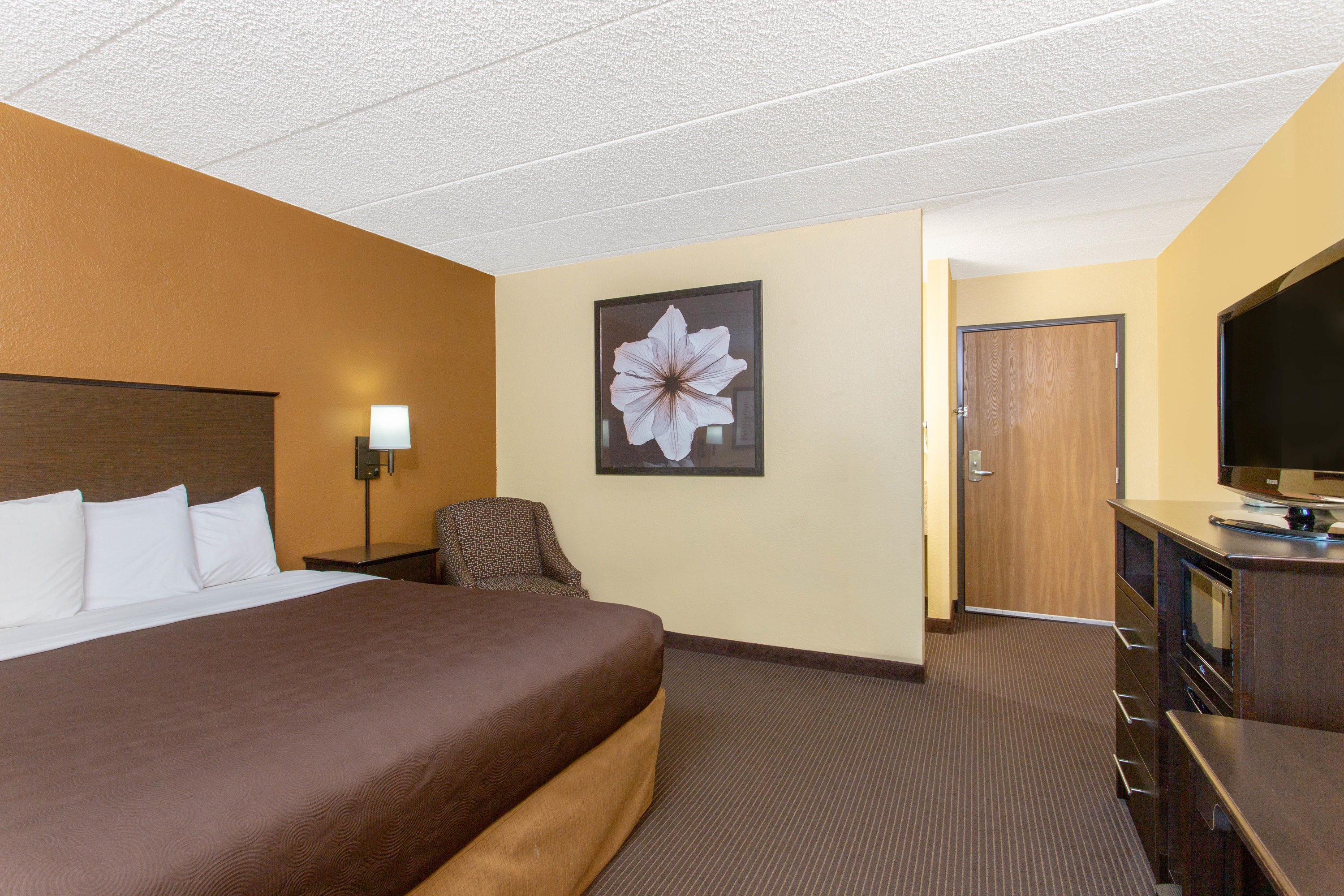 Guest room at the AmericInn by Wyndham West Bend in West Bend, Wisconsin
