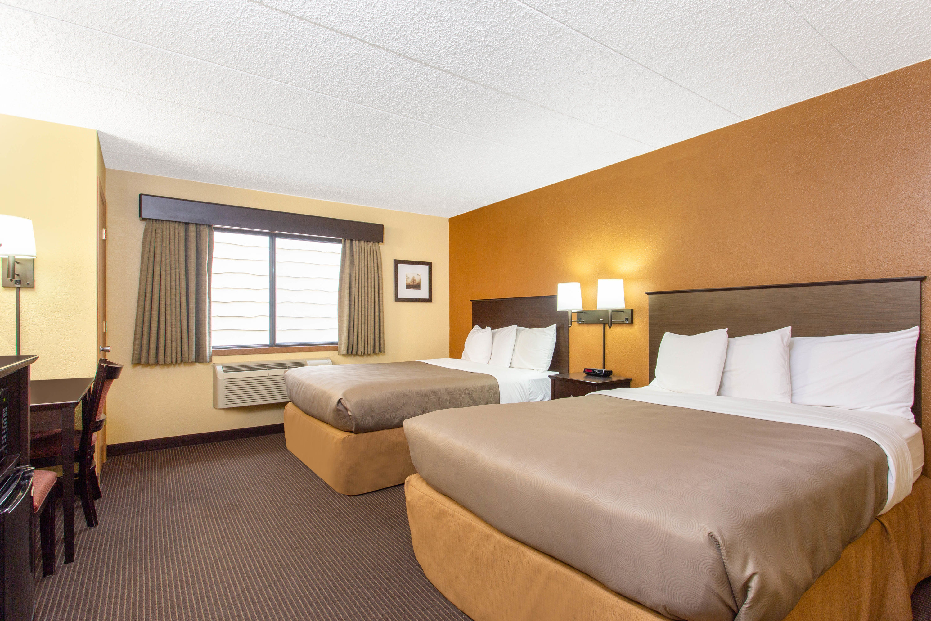 Guest room at the AmericInn by Wyndham West Bend in West Bend, Wisconsin