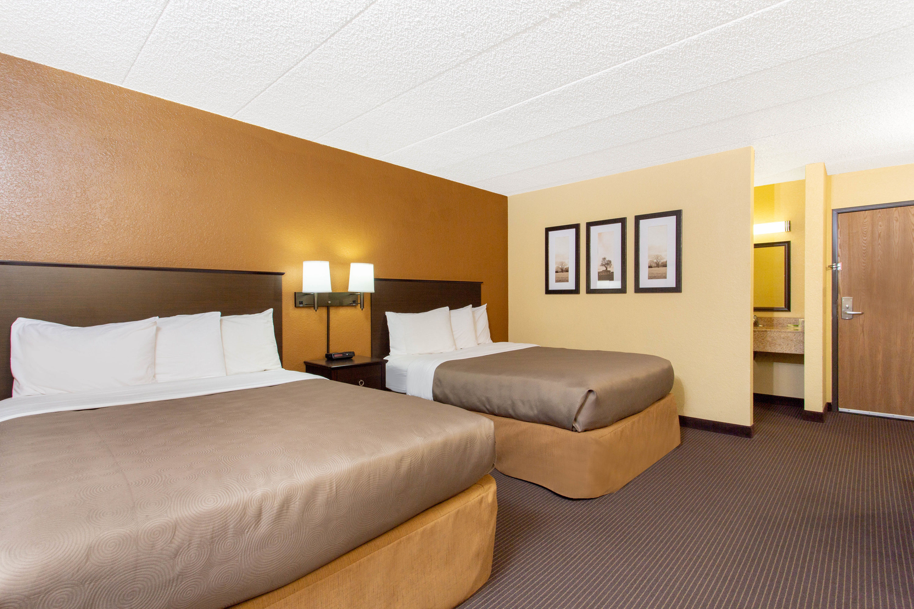 Guest room at the AmericInn by Wyndham West Bend in West Bend, Wisconsin