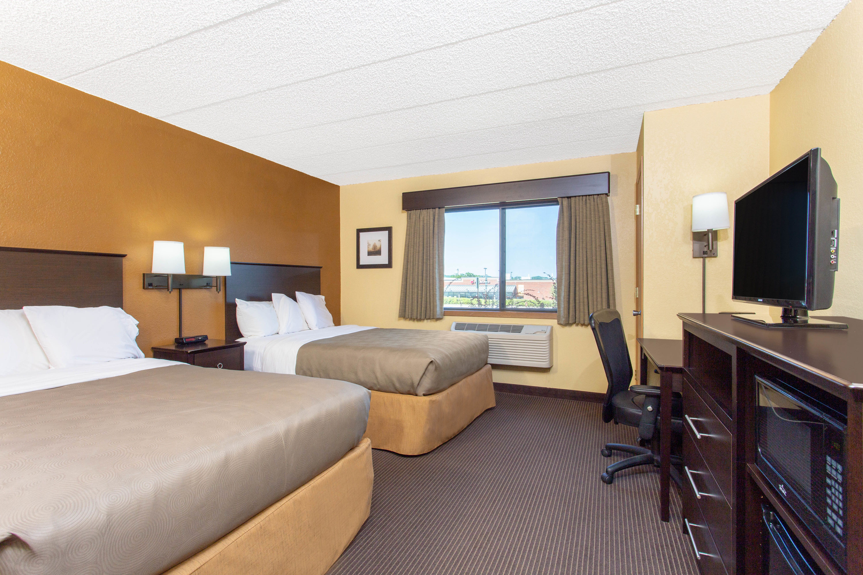 Guest room at the AmericInn by Wyndham West Bend in West Bend, Wisconsin