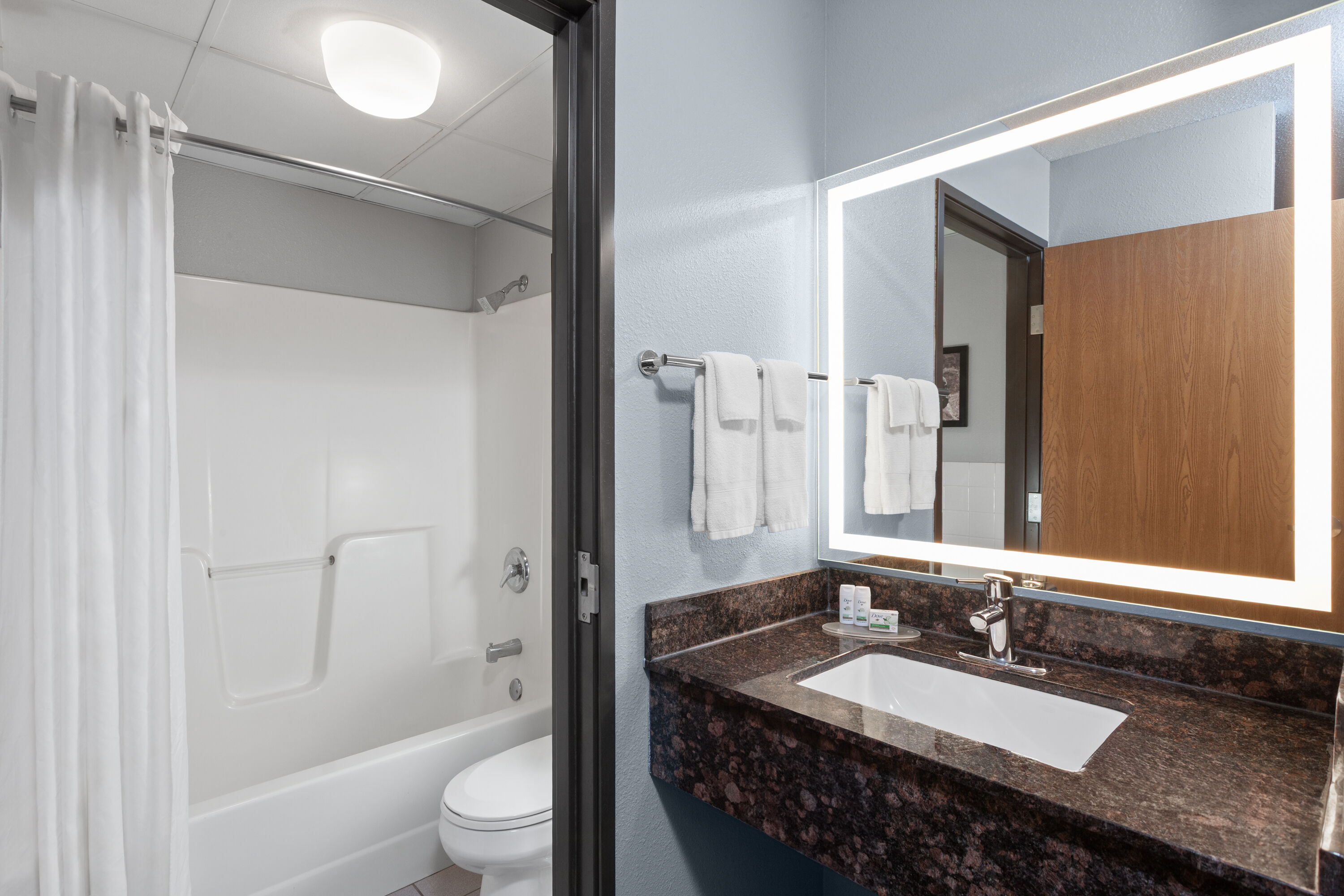 Guest room bath at the AmericInn by Wyndham West Salem in West Salem, Wisconsin