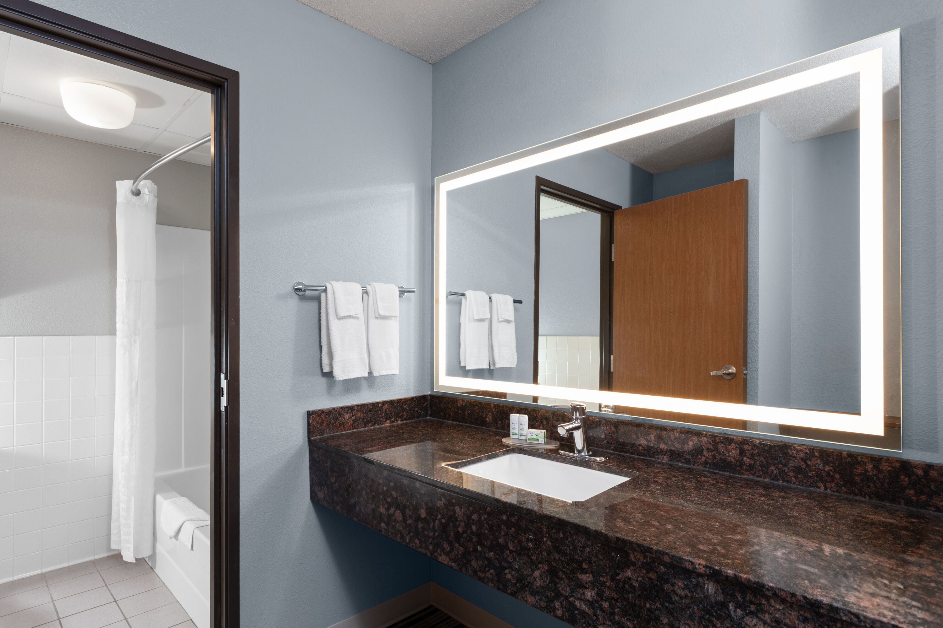 Guest room bath at the AmericInn by Wyndham West Salem in West Salem, Wisconsin