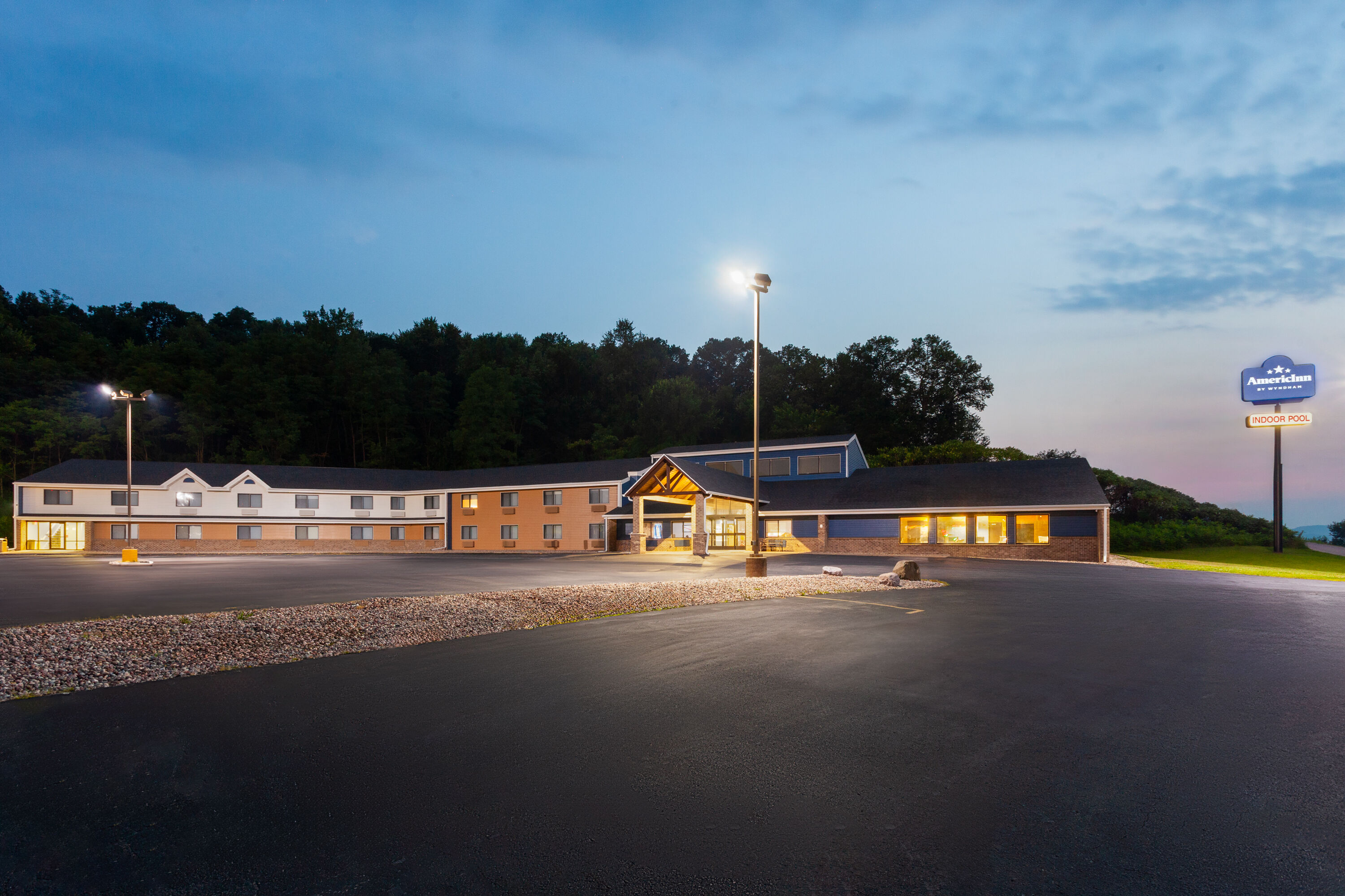 Exterior Dusk Image of AmericInn by Wyndham West Salem hotel in West Salem, Wisconsin