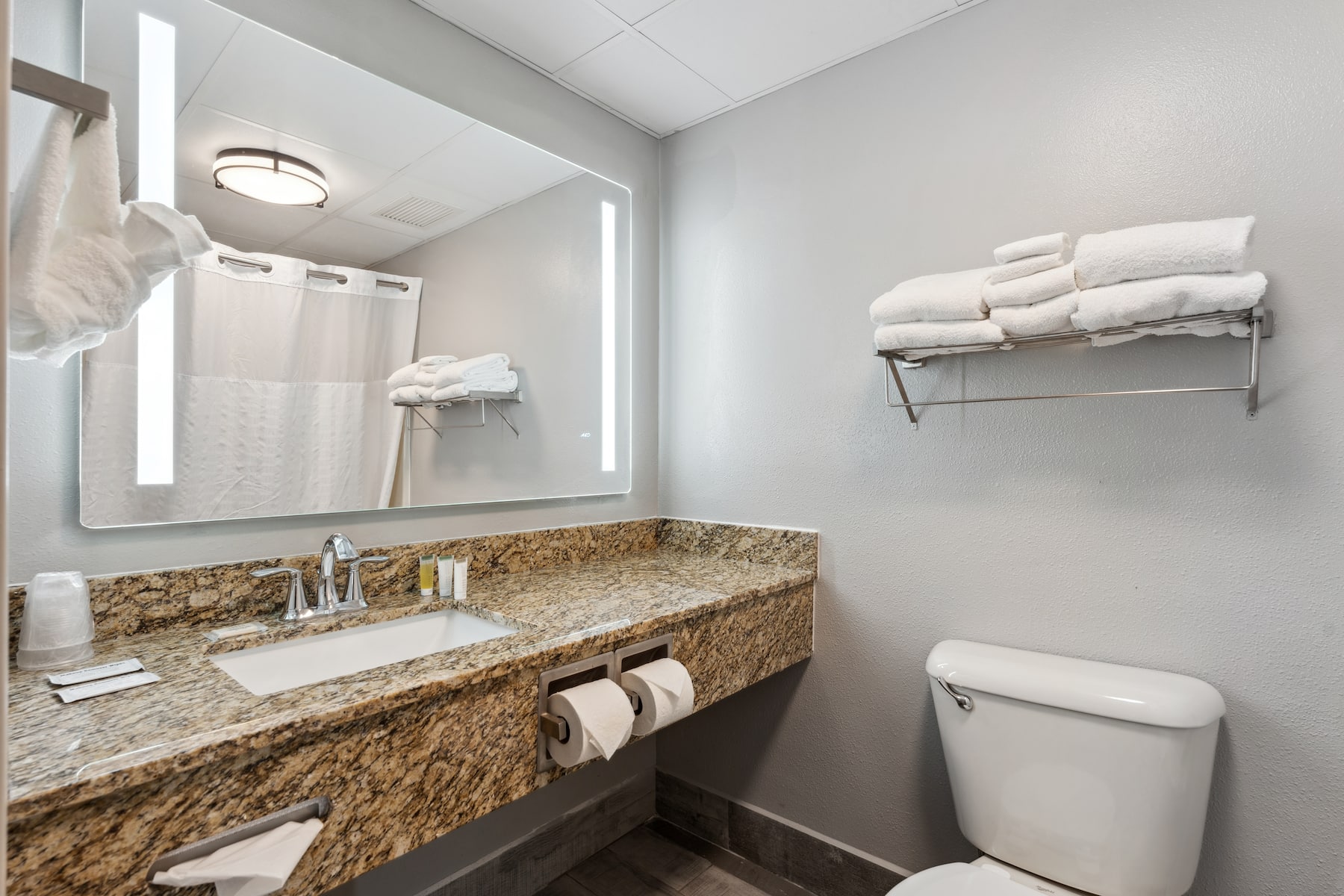 Guest room bath at the AmericInn by Wyndham Wisconsin Dells in Wisconsin Dells, Wisconsin