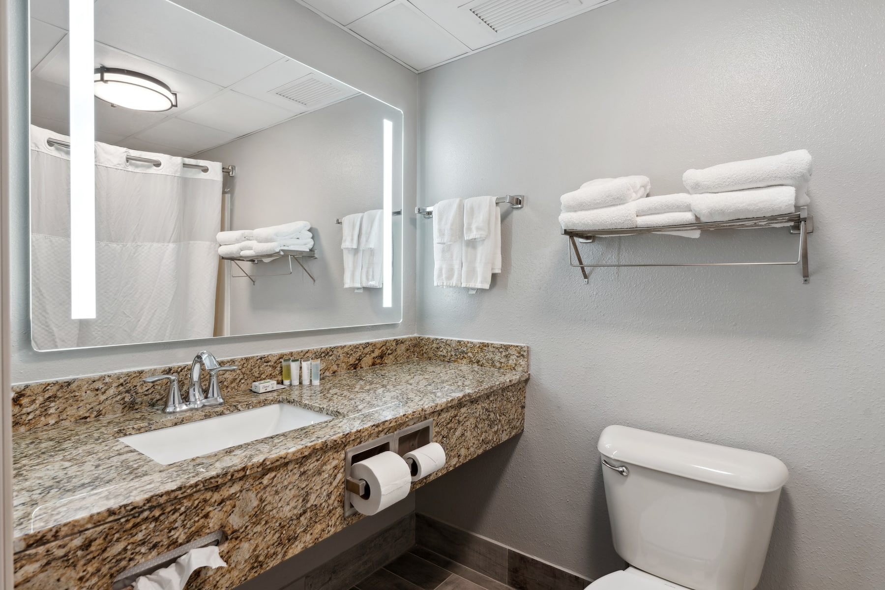 Guest room bath at the AmericInn by Wyndham Wisconsin Dells in Wisconsin Dells, Wisconsin