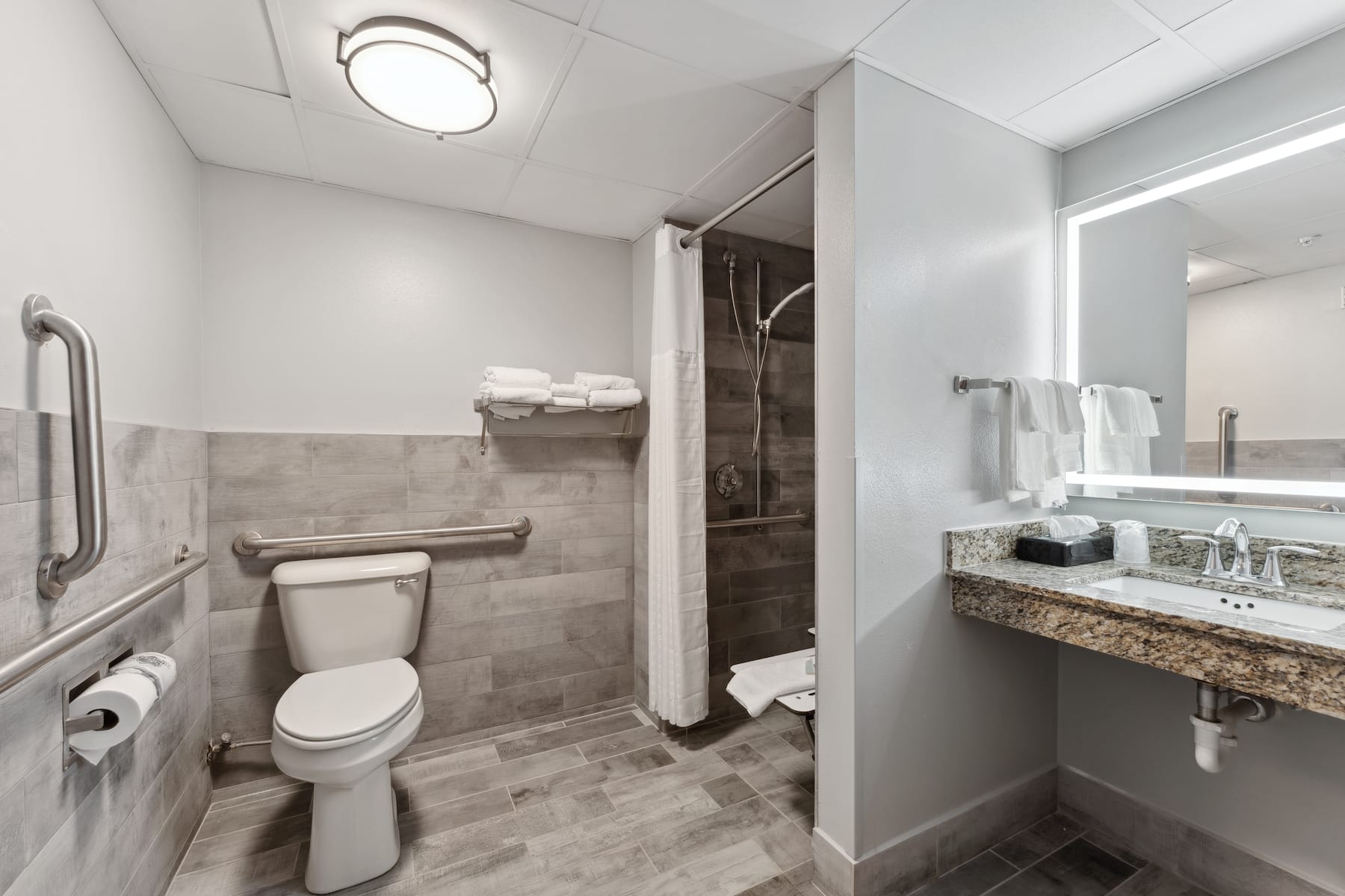 Guest room bath at the AmericInn by Wyndham Wisconsin Dells in Wisconsin Dells, Wisconsin