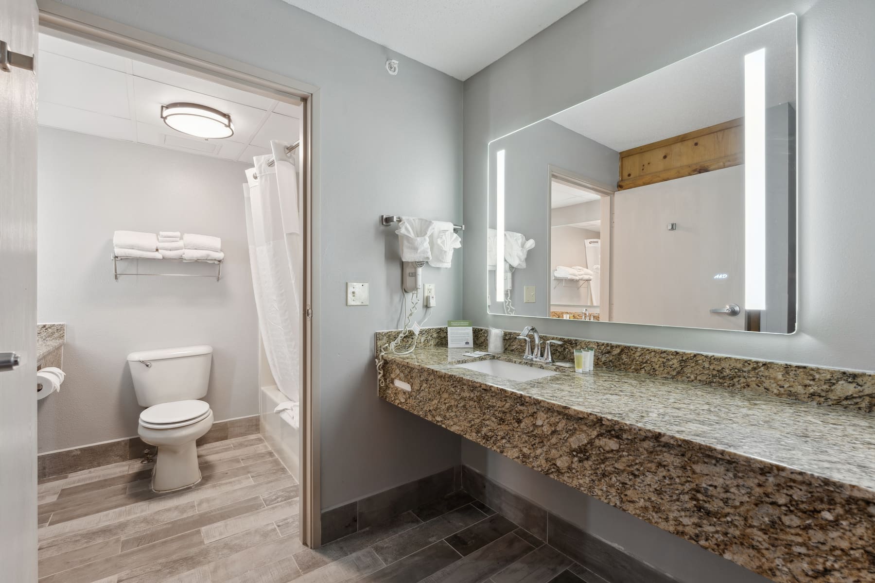 Guest room bath at the AmericInn by Wyndham Wisconsin Dells in Wisconsin Dells, Wisconsin