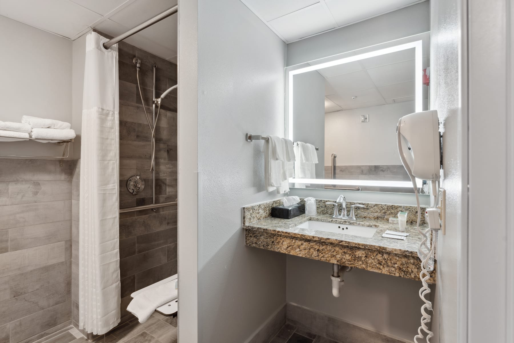Guest room bath at the AmericInn by Wyndham Wisconsin Dells in Wisconsin Dells, Wisconsin