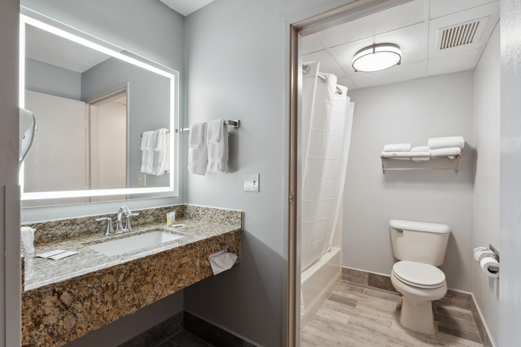 Guest room bath at the AmericInn by Wyndham Wisconsin Dells in Wisconsin Dells, Wisconsin