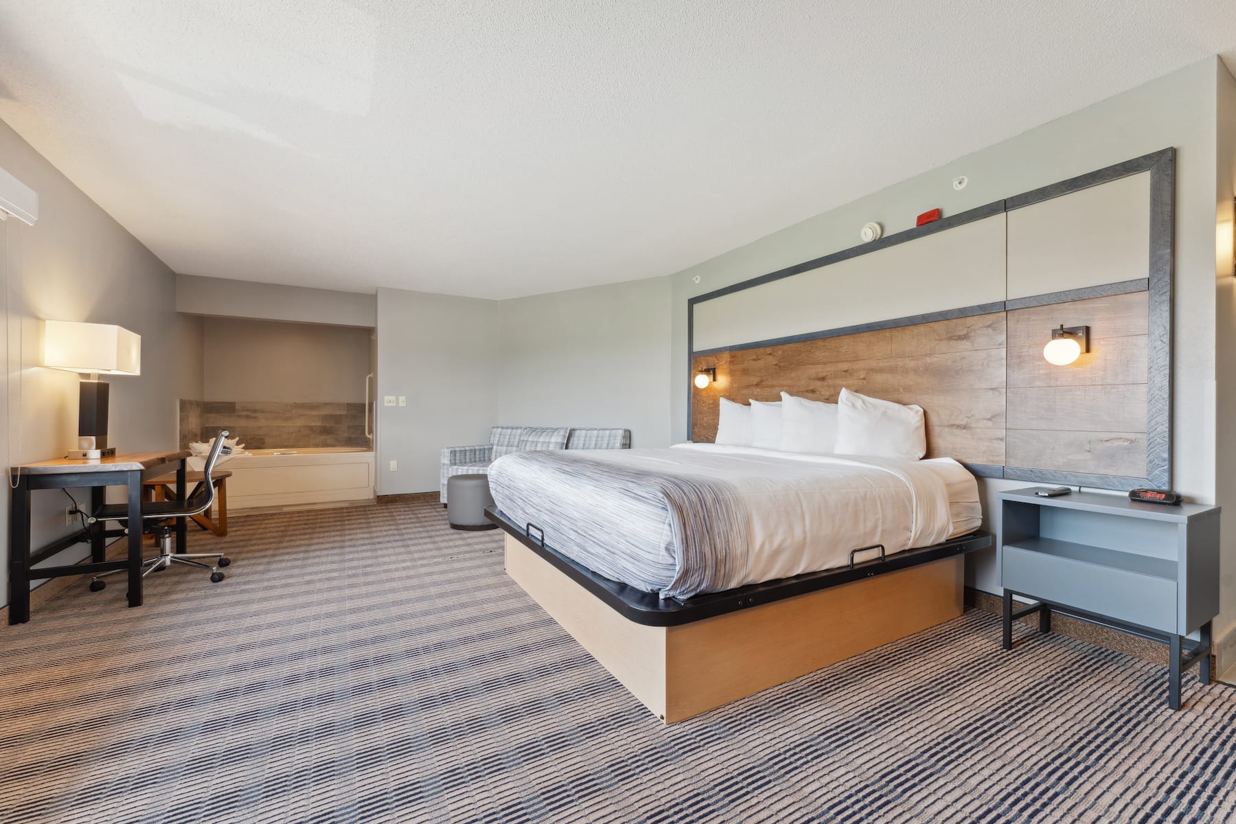 King bed guest room at the AmericInn by Wyndham Wisconsin Dells in Wisconsin Dells, Wisconsin