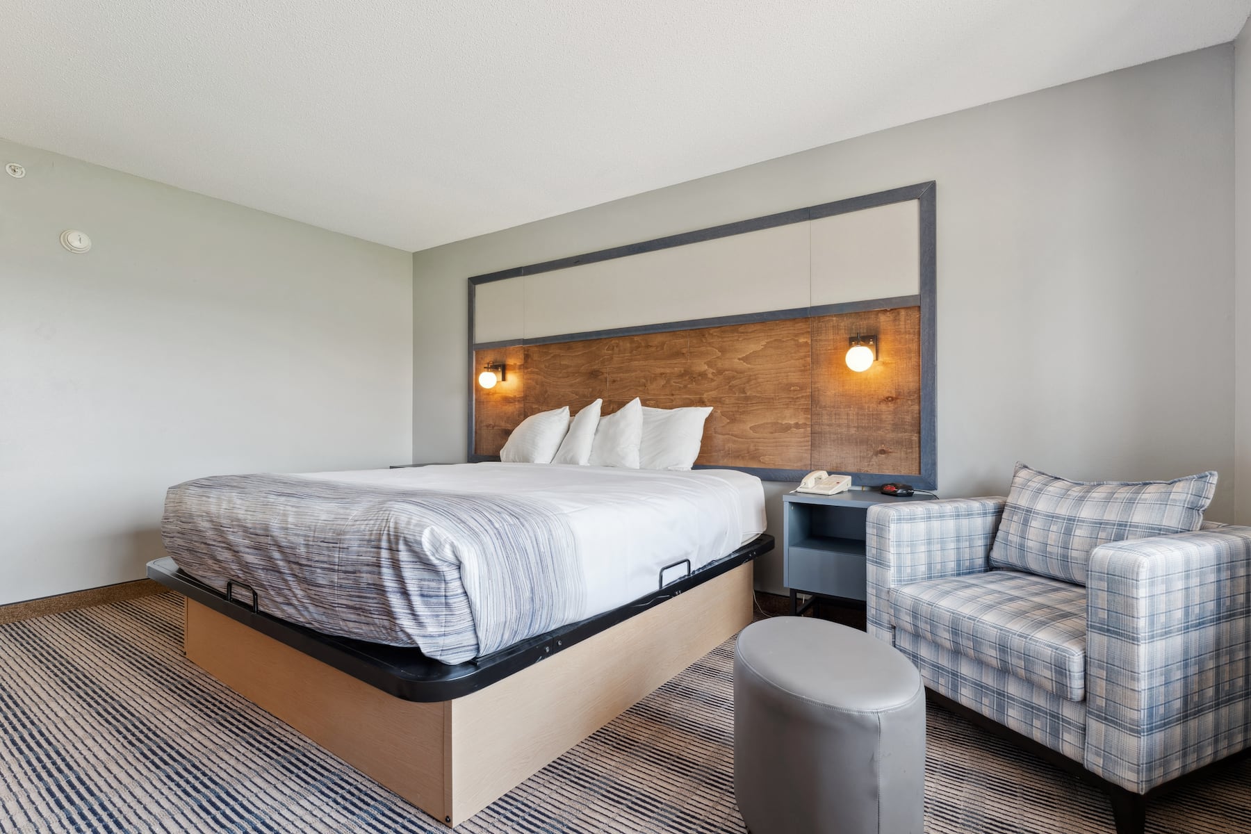 King bed guest room at the AmericInn by Wyndham Wisconsin Dells in Wisconsin Dells, Wisconsin