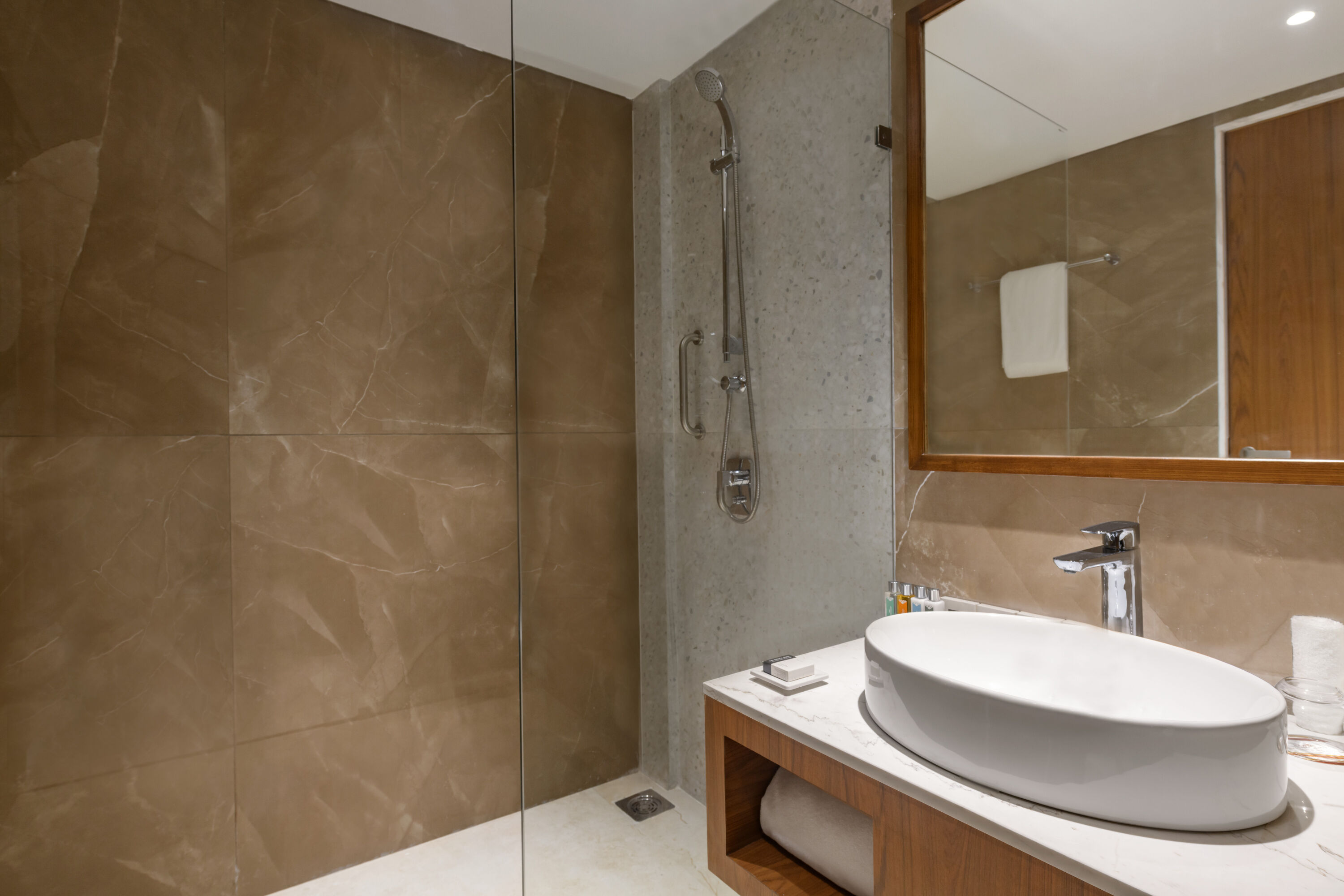 Guest room bath at the Hawthorn Suites by Wyndham Dwarka in Dwarka, Other than US/Canada