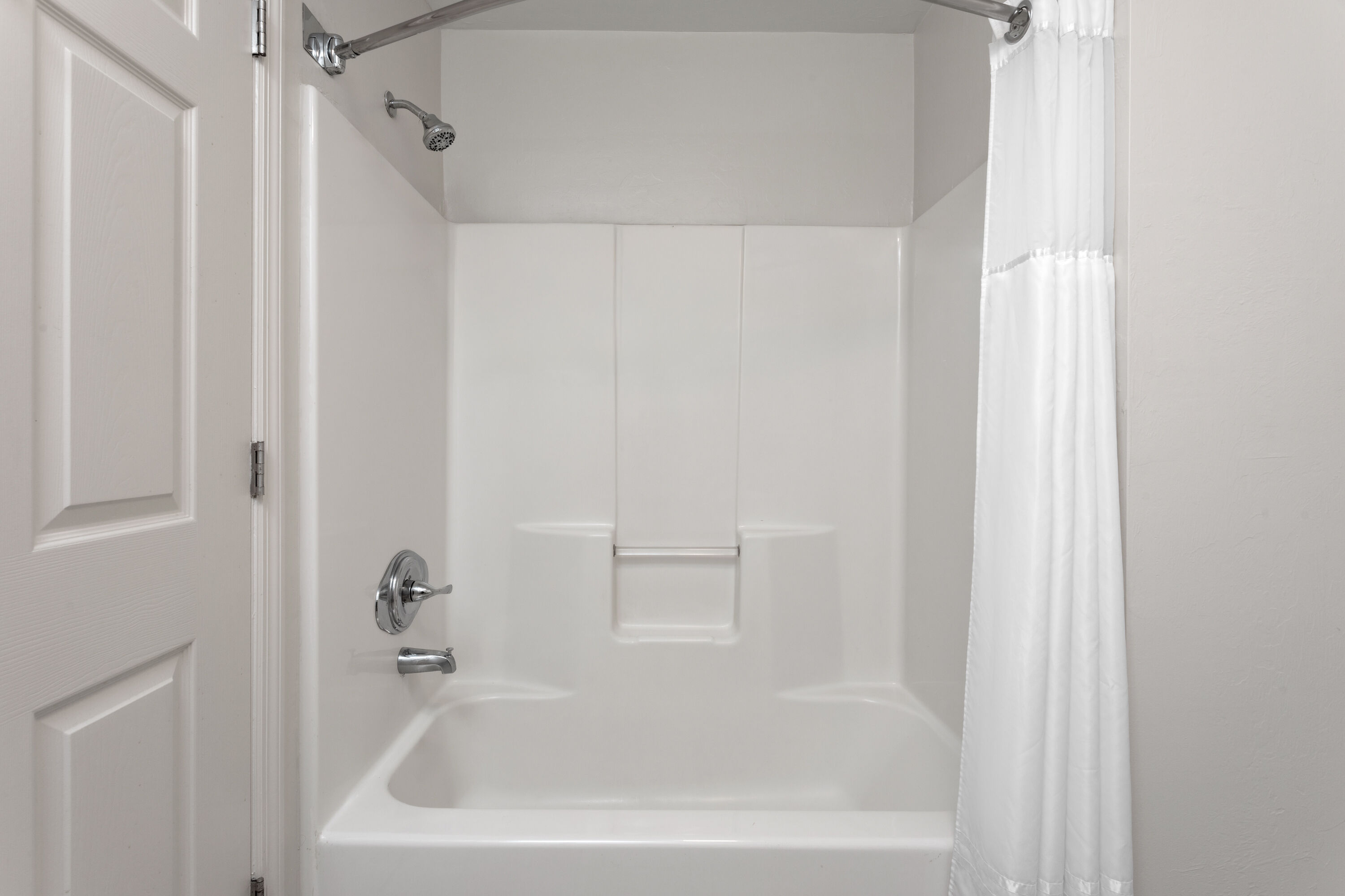 Guest room bath at the Hawthorn Extended Stay by Wyndham Naples in Naples, Florida