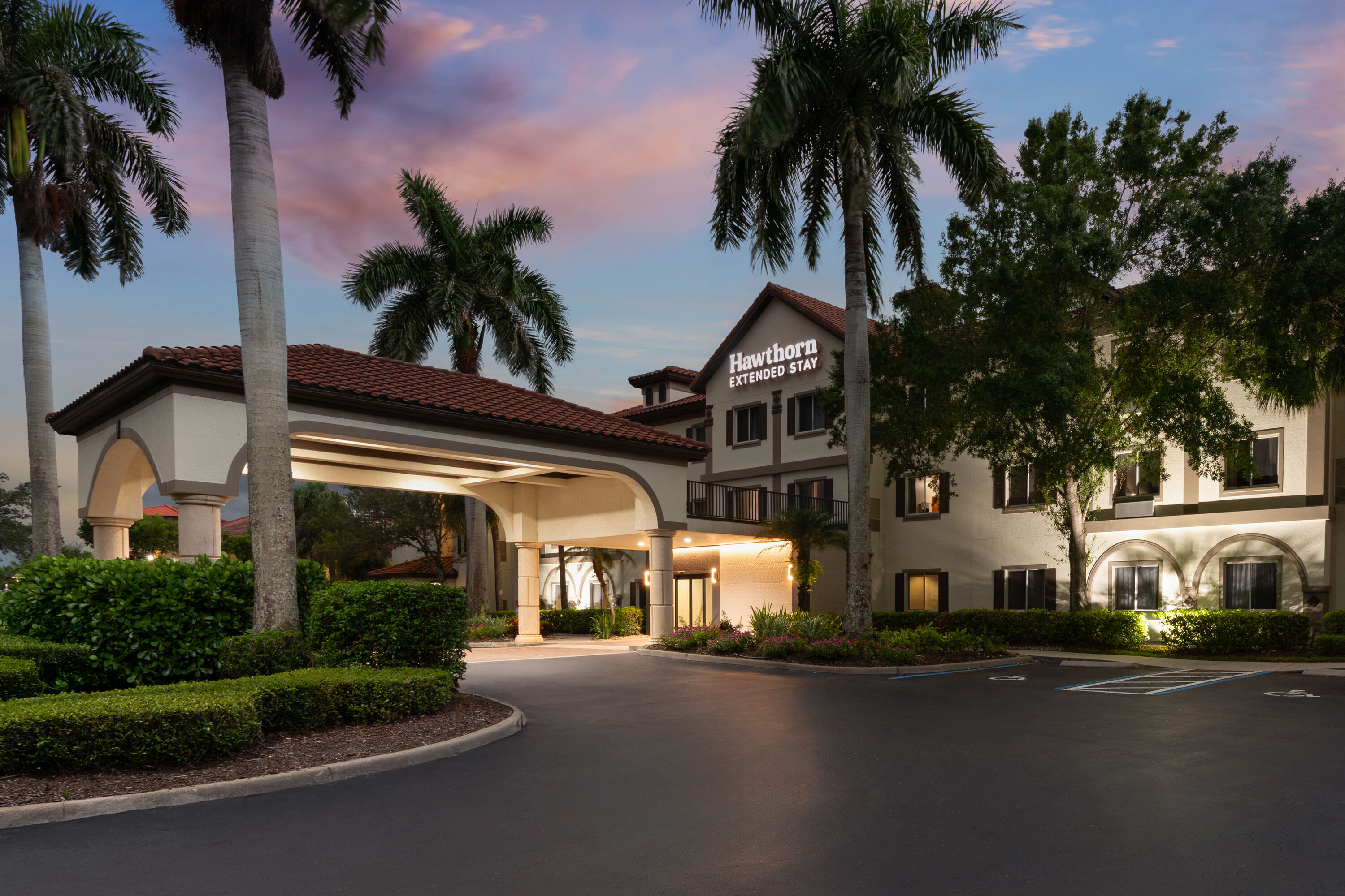 Exterior Dusk Image of Hawthorn Extended Stay by Wyndham Naples hotel in Naples, Florida