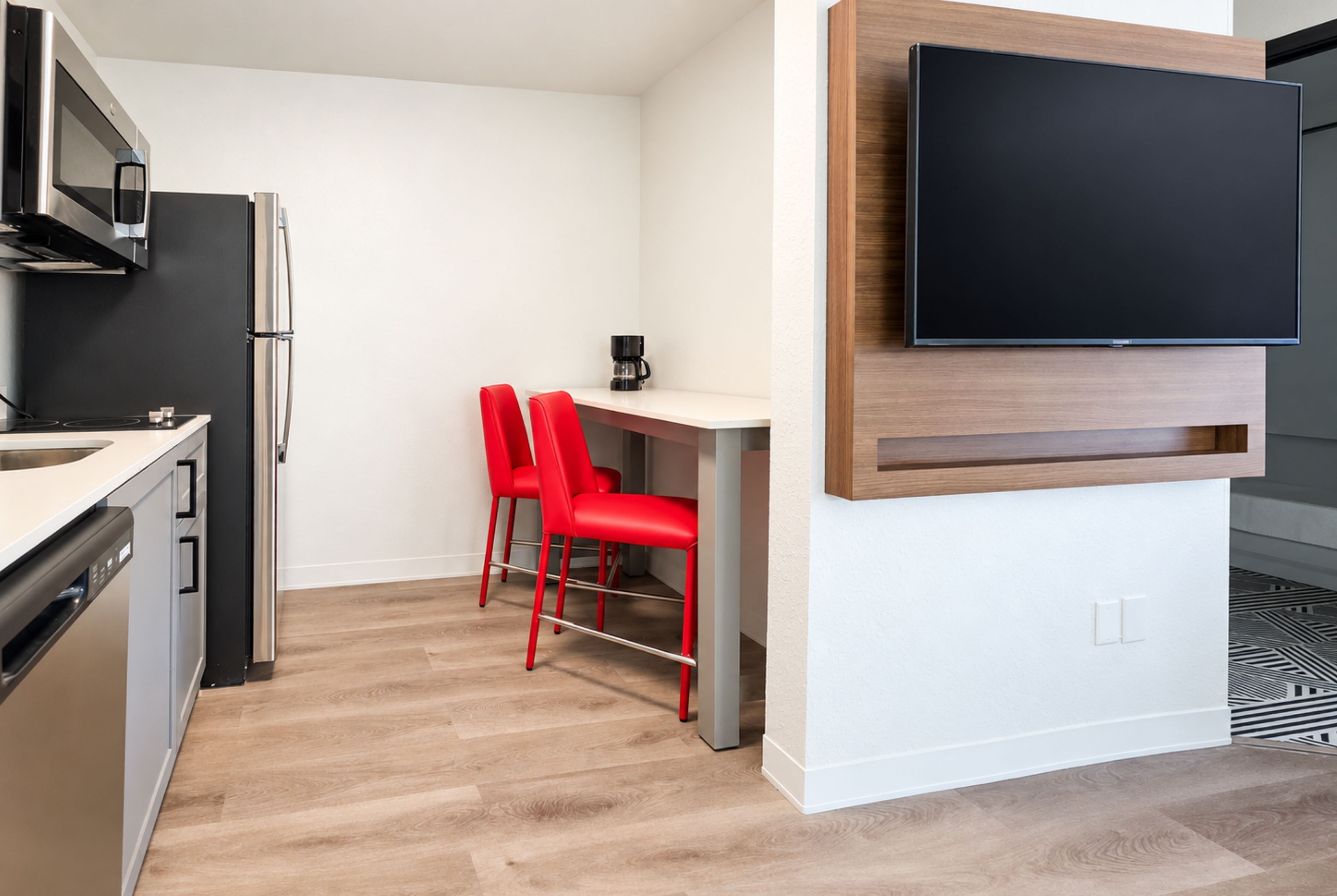 Guest room kitchen at Hawthorn Extended Stay by Wyndham Auburn Hills Detroit in Auburn Hills, Michigan