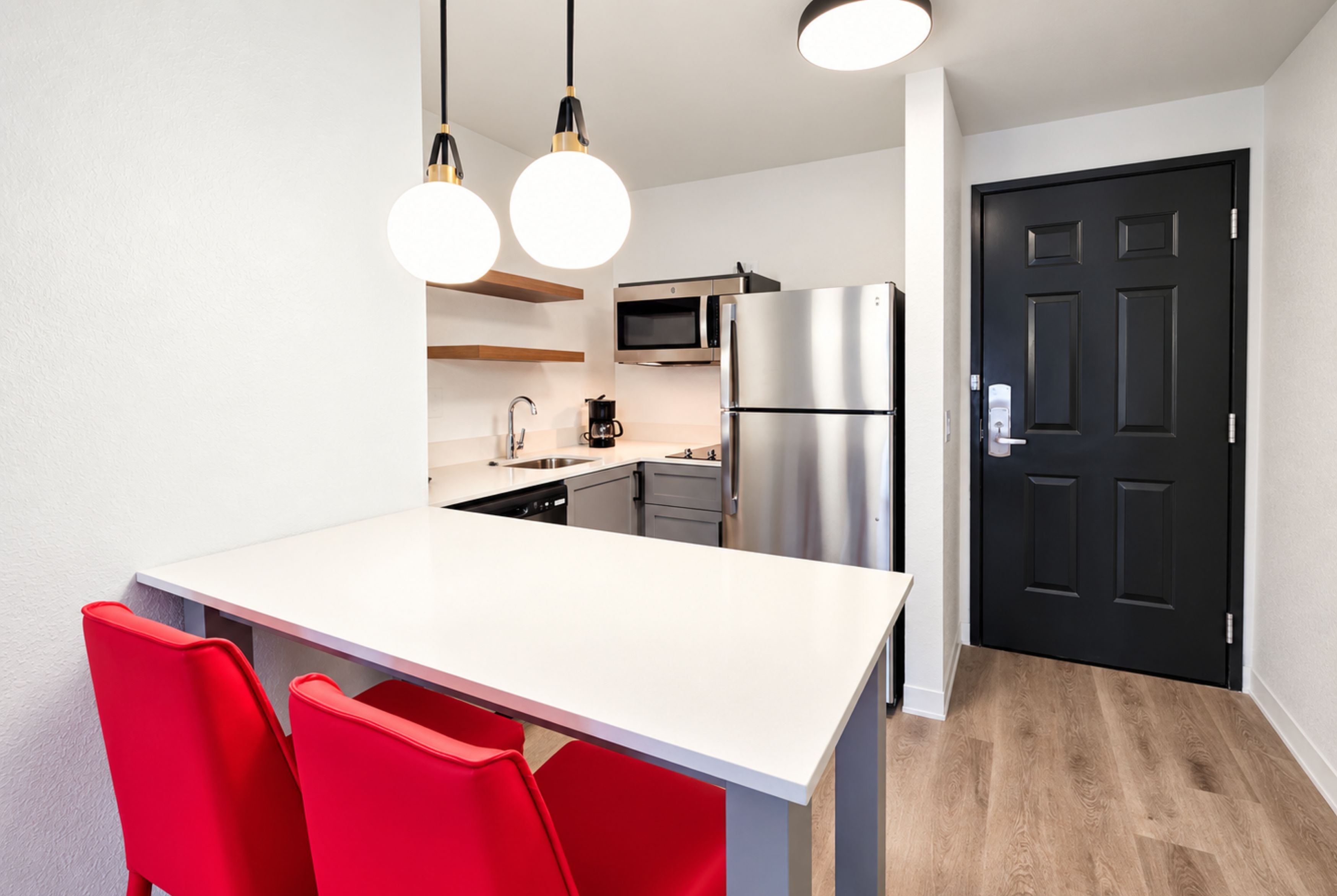 Guest room kitchen at Hawthorn Extended Stay by Wyndham Auburn Hills Detroit in Auburn Hills, Michigan