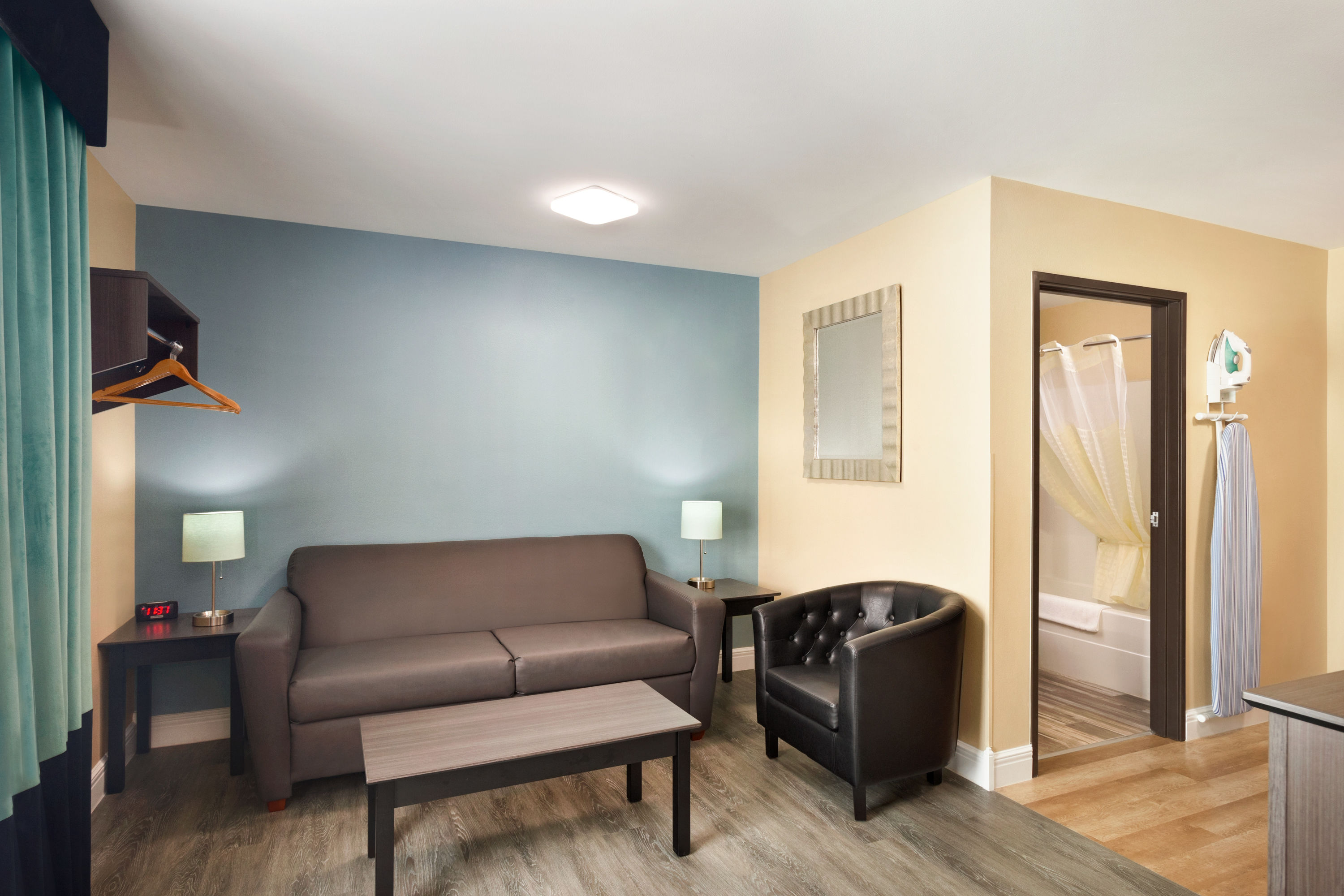 King bed guest room at the Hawthorn Extended Stay by Wyndham Saint Robert in Saint Robert, Missouri