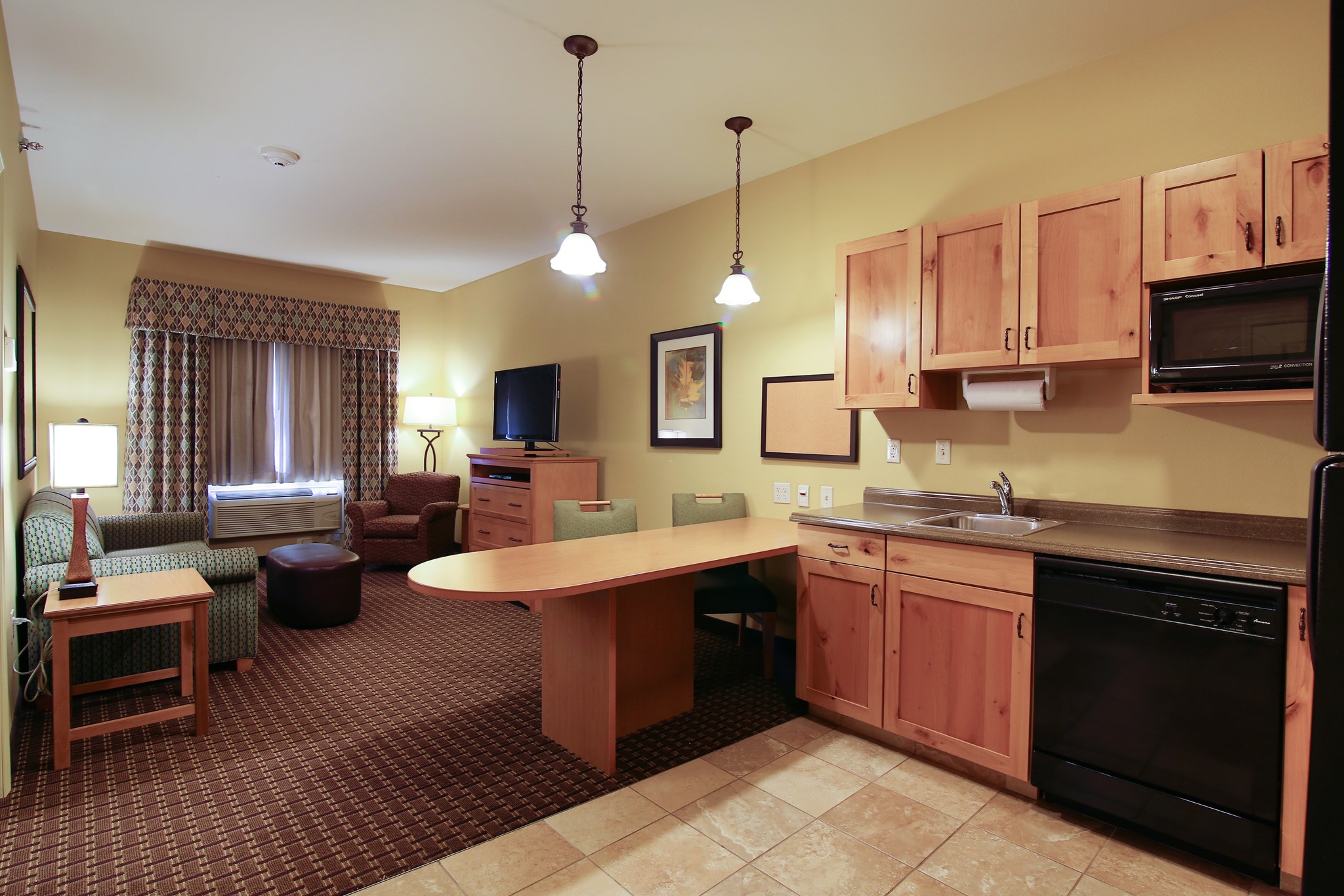 Guest room at the Hawthorn Extended Stay by Wyndham Minot in Minot, North Dakota