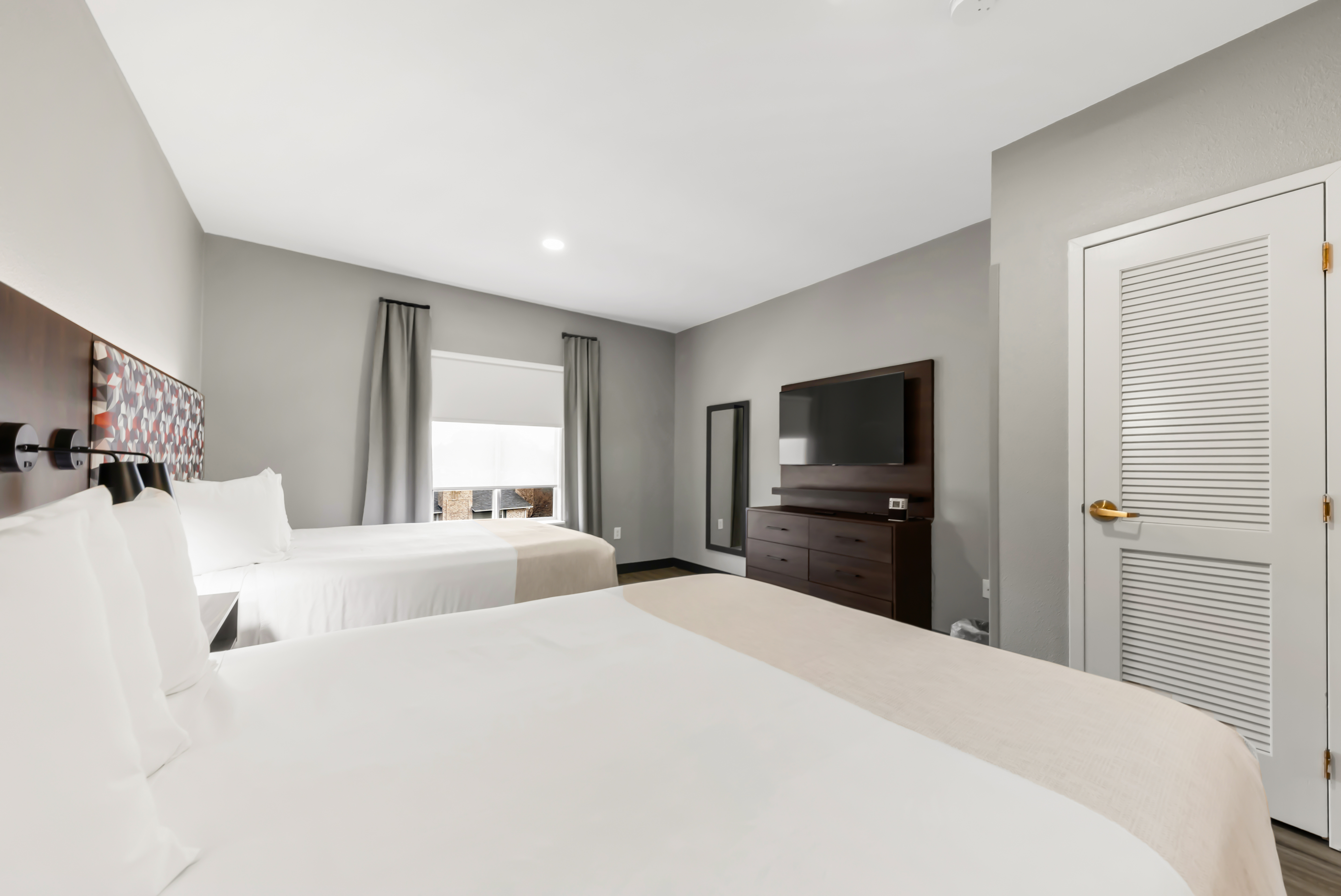 Guest room at the Hawthorn Extended Stay by Wyndham College Station in College Station, Texas