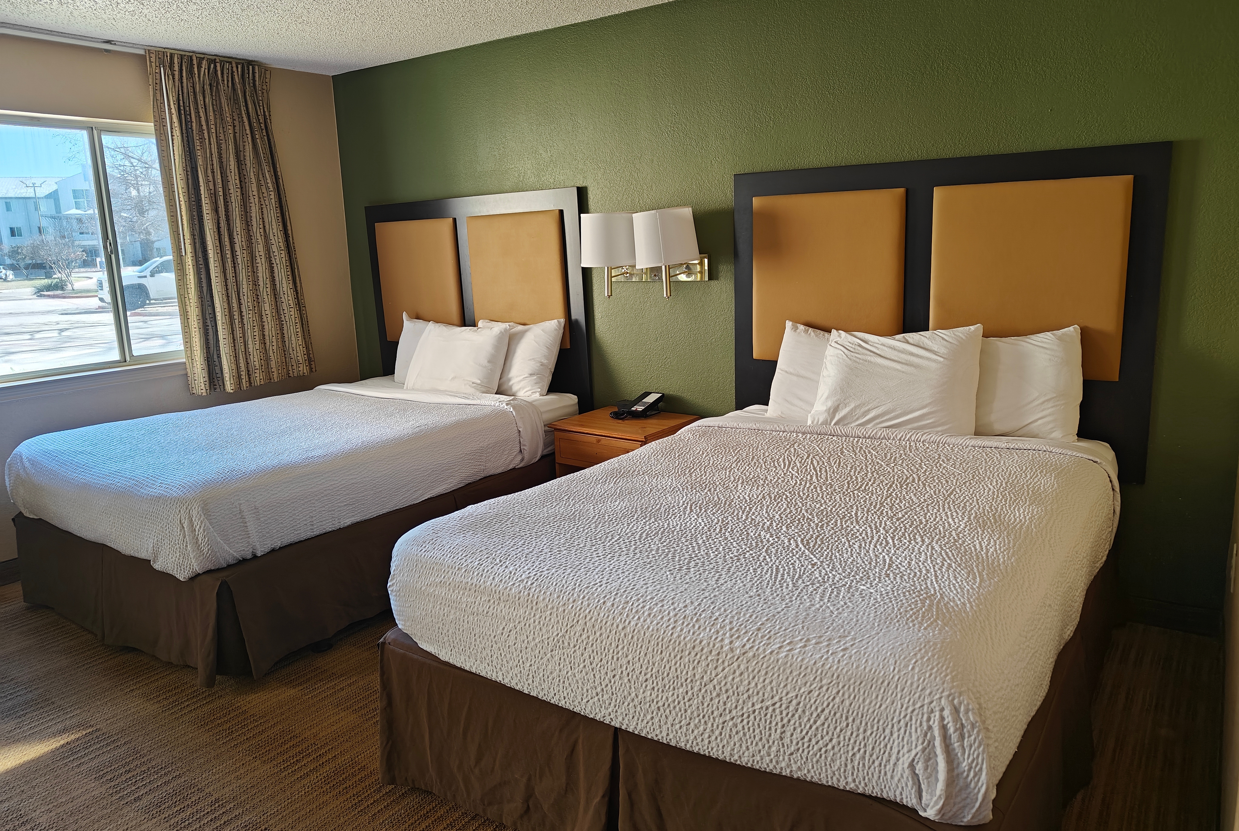 Guest room at the Hawthorn Extended Stay by Wyndham DFW Airport North in Irving, Texas