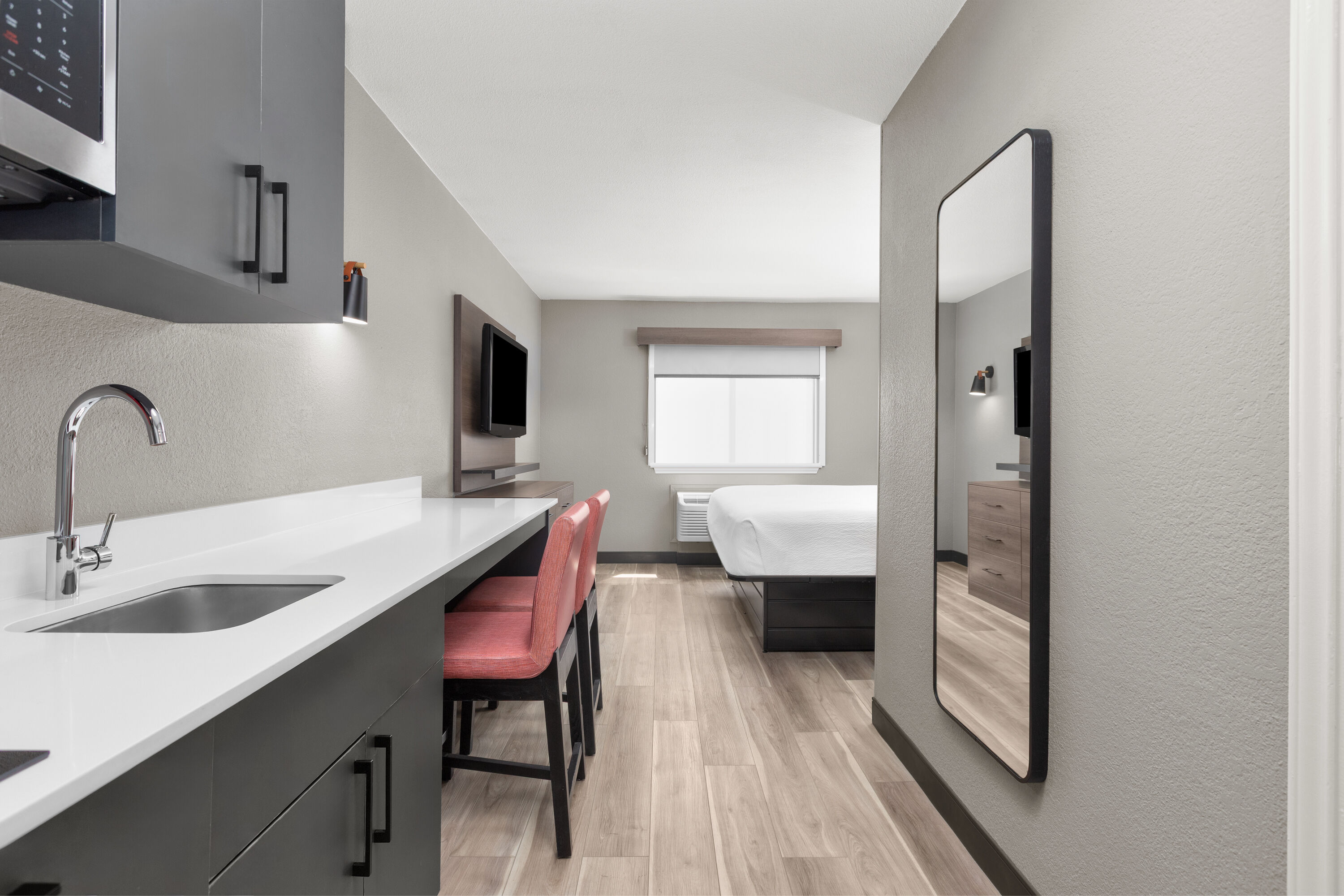 Guest room at the Hawthorn Extended Stay by Wyndham DFW Airport North in Irving, Texas