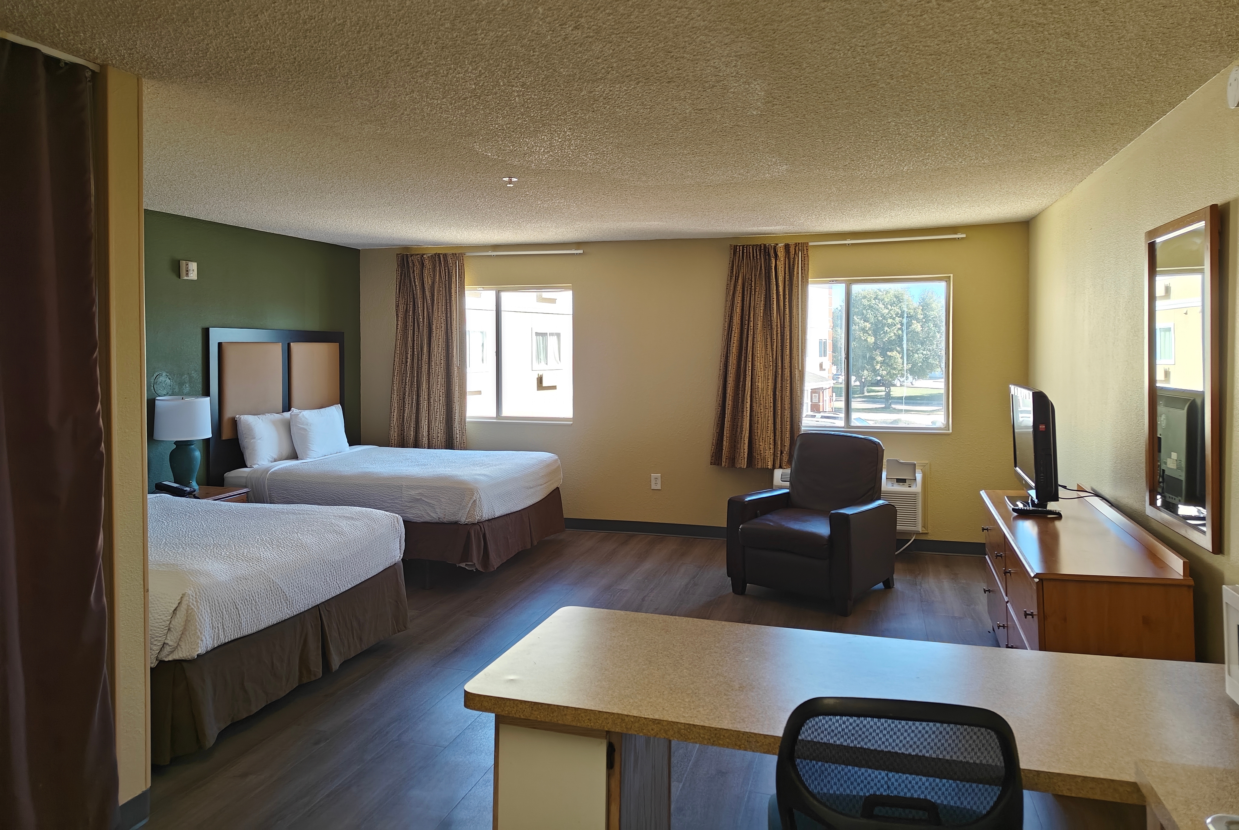 Guest room at the Hawthorn Extended Stay by Wyndham DFW Airport North in Irving, Texas