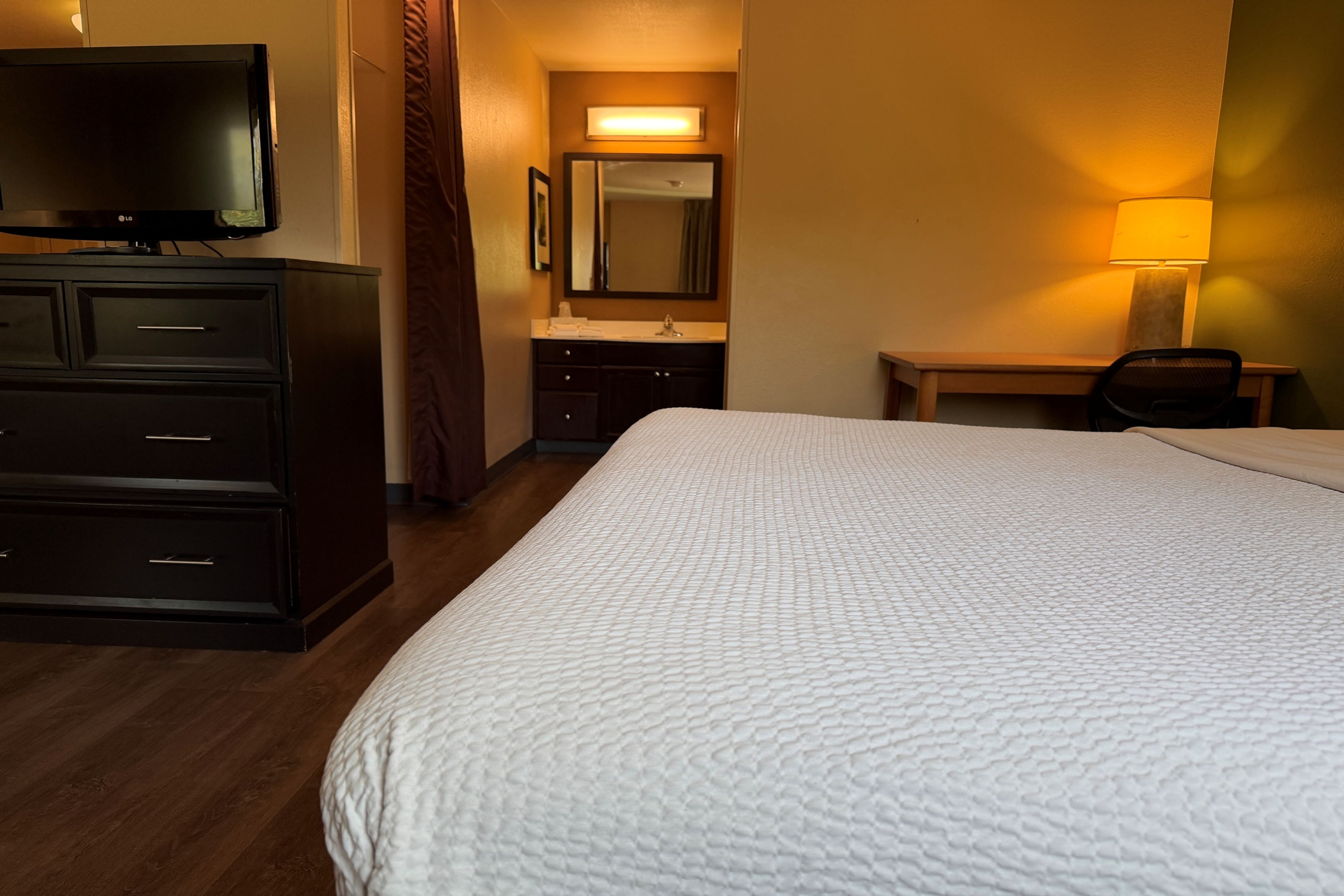 Guest room at the Hawthorn Extended Stay by Wyndham Irving Las Colinas in Irving, Texas