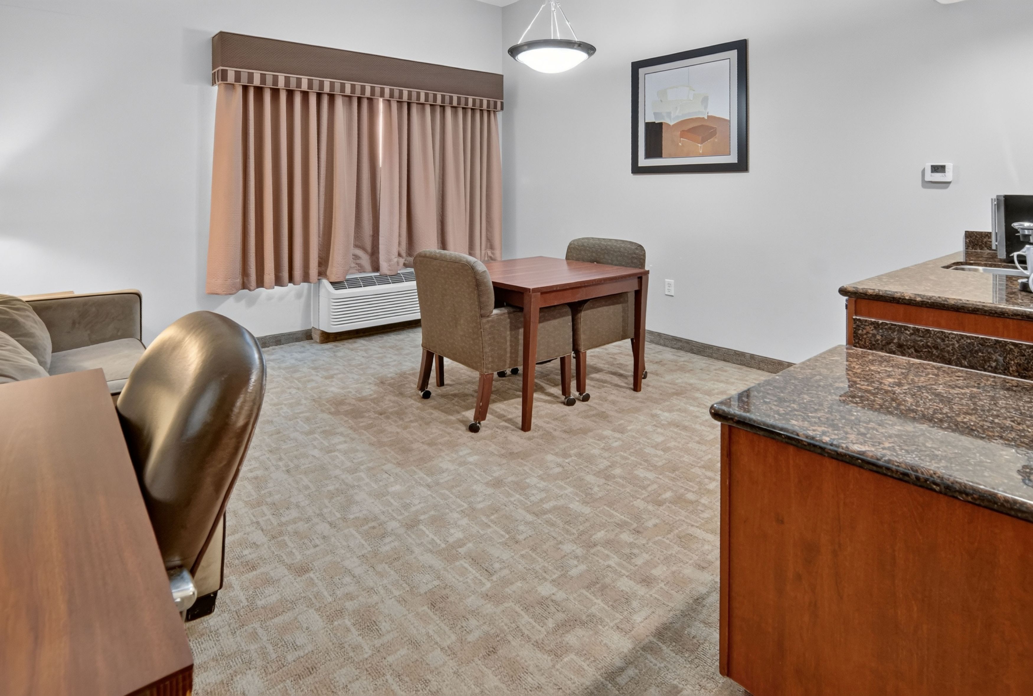 Guest room at the Hawthorn Extended Stay by Wyndham Killeen in Killeen, Texas