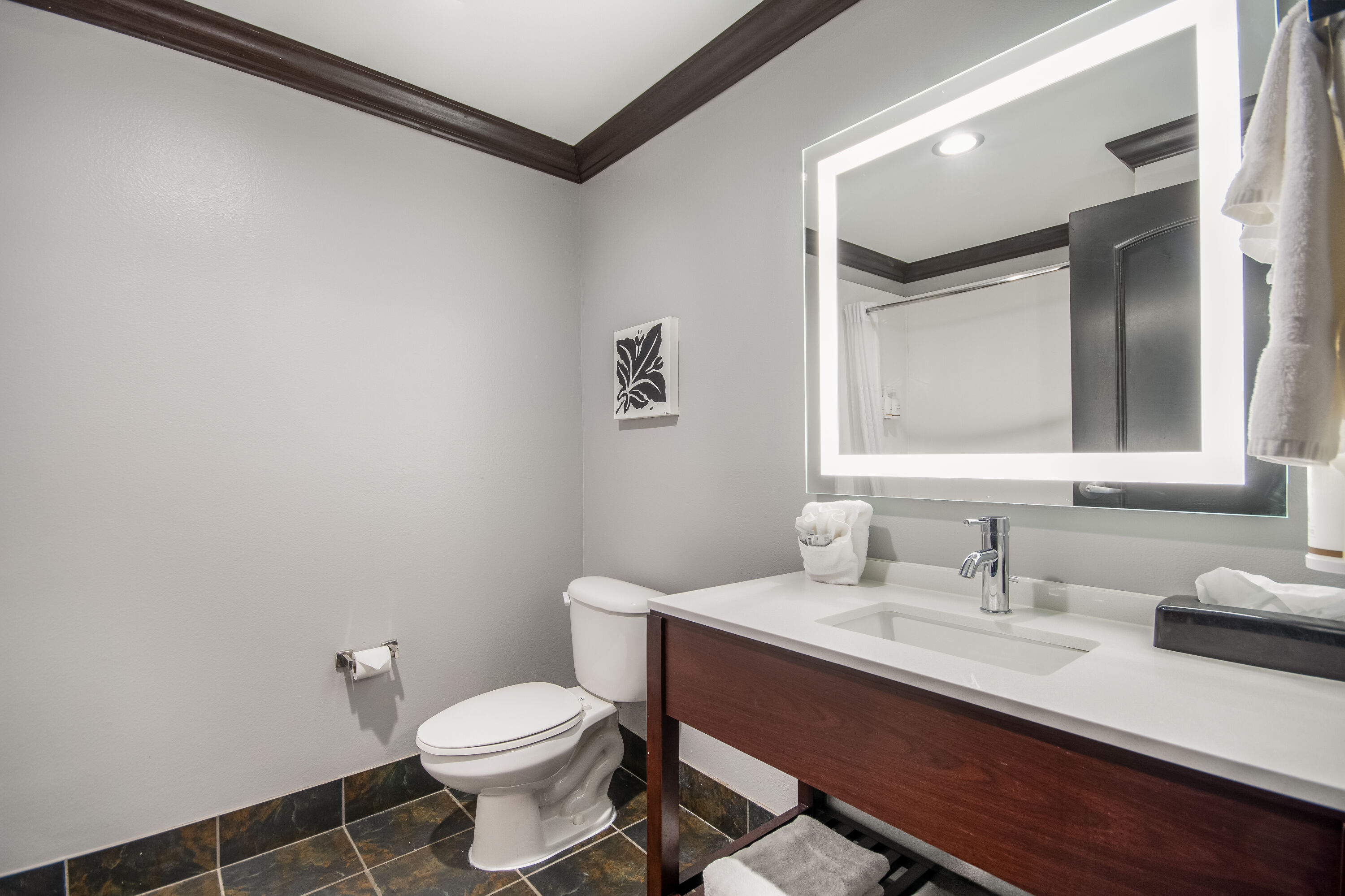 Guest room bath at the Hawthorn Suites by Wyndham Lubbock in Lubbock, Texas