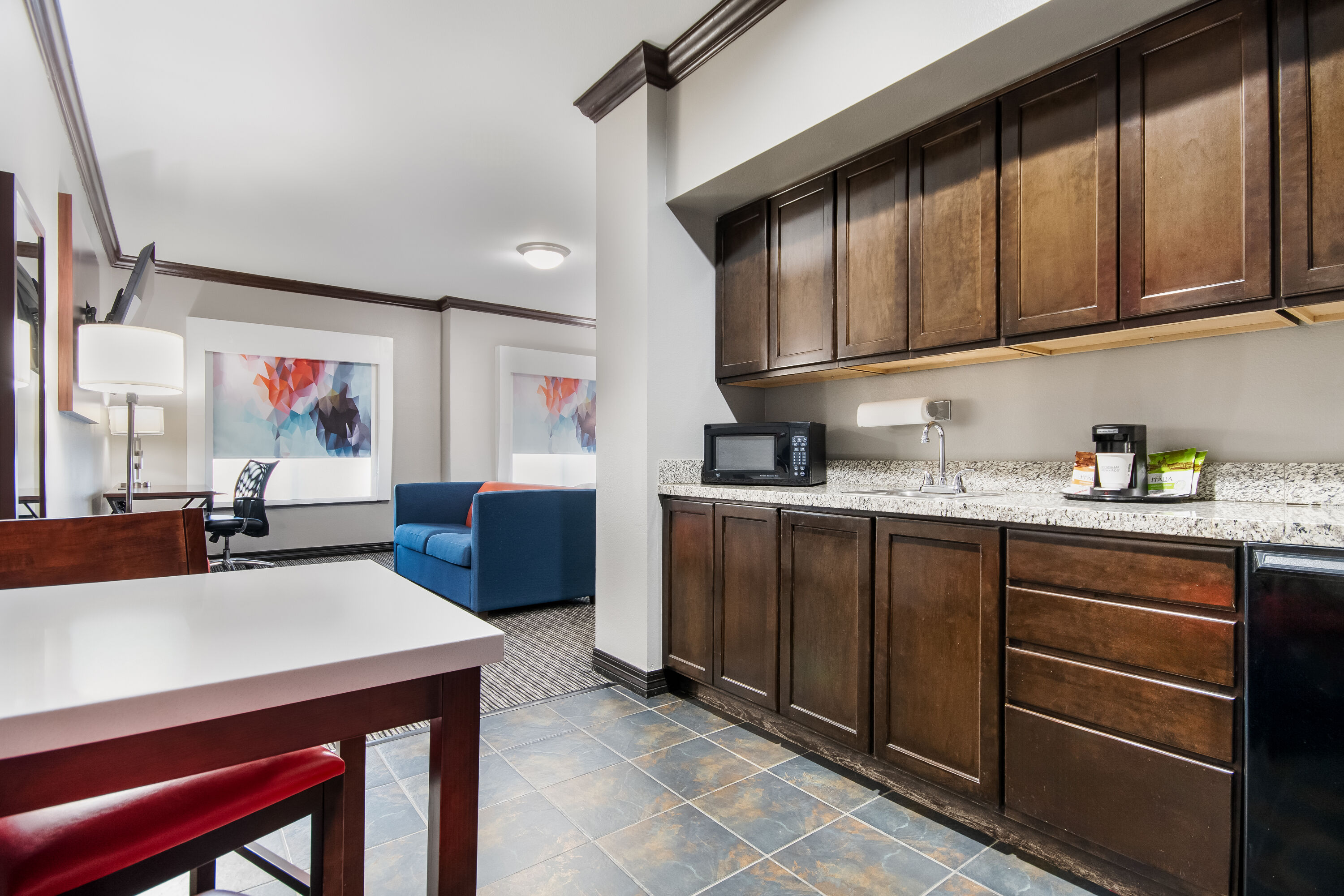 King bed guest room at the Hawthorn Suites by Wyndham Lubbock in Lubbock, Texas